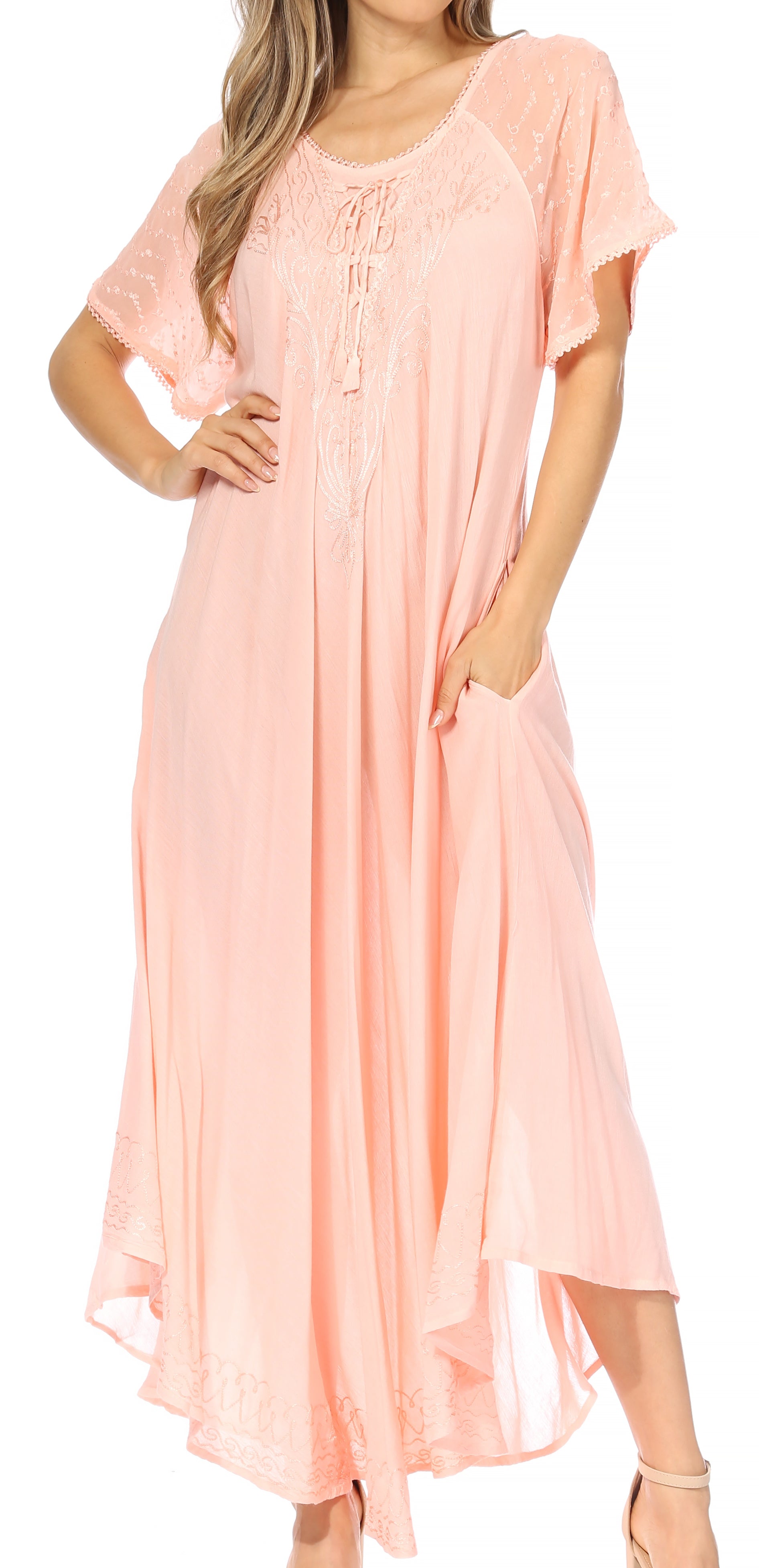 Woman wearing a light pink dress on a white background