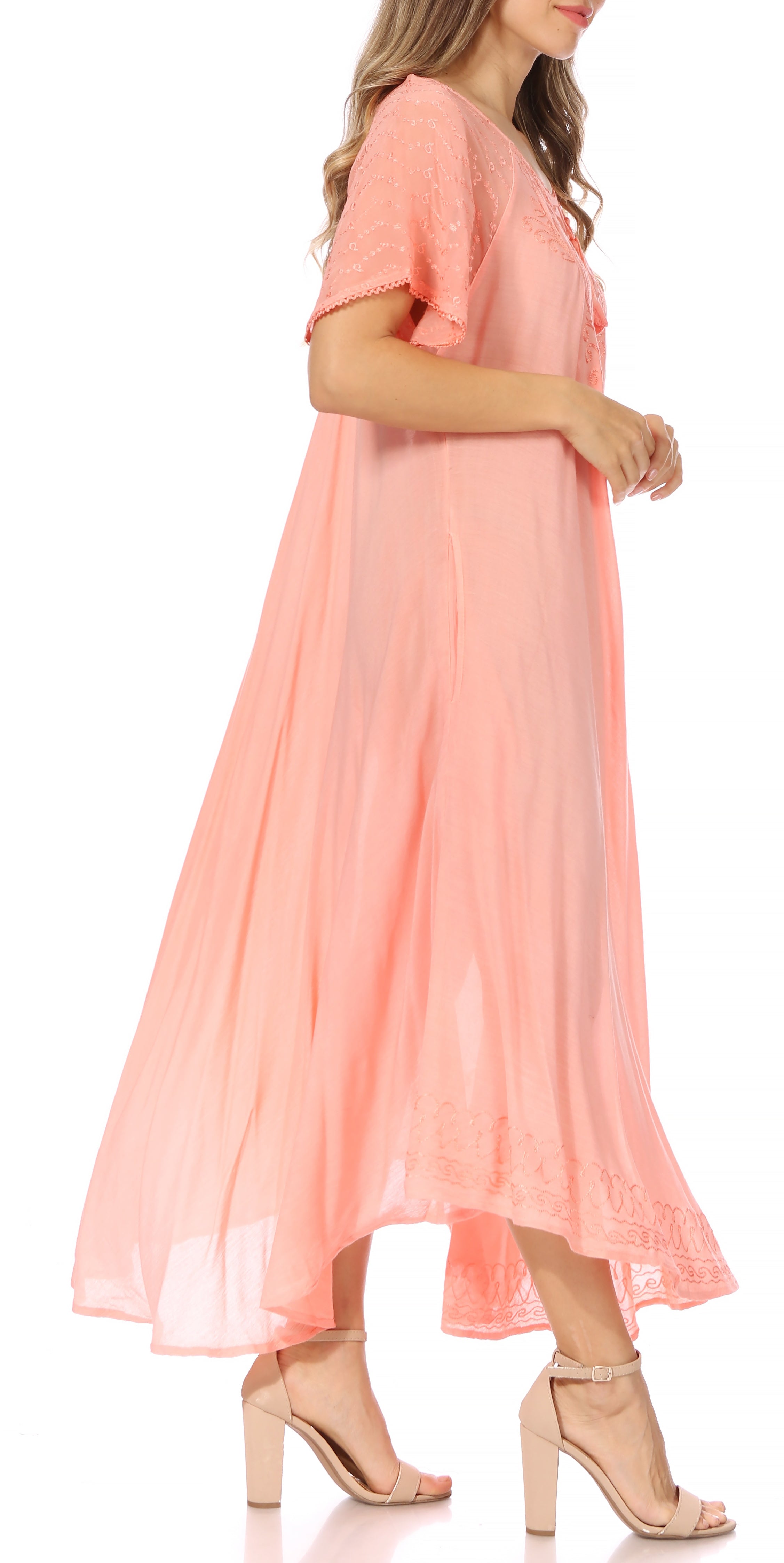 Woman wearing a pink dress on a white background