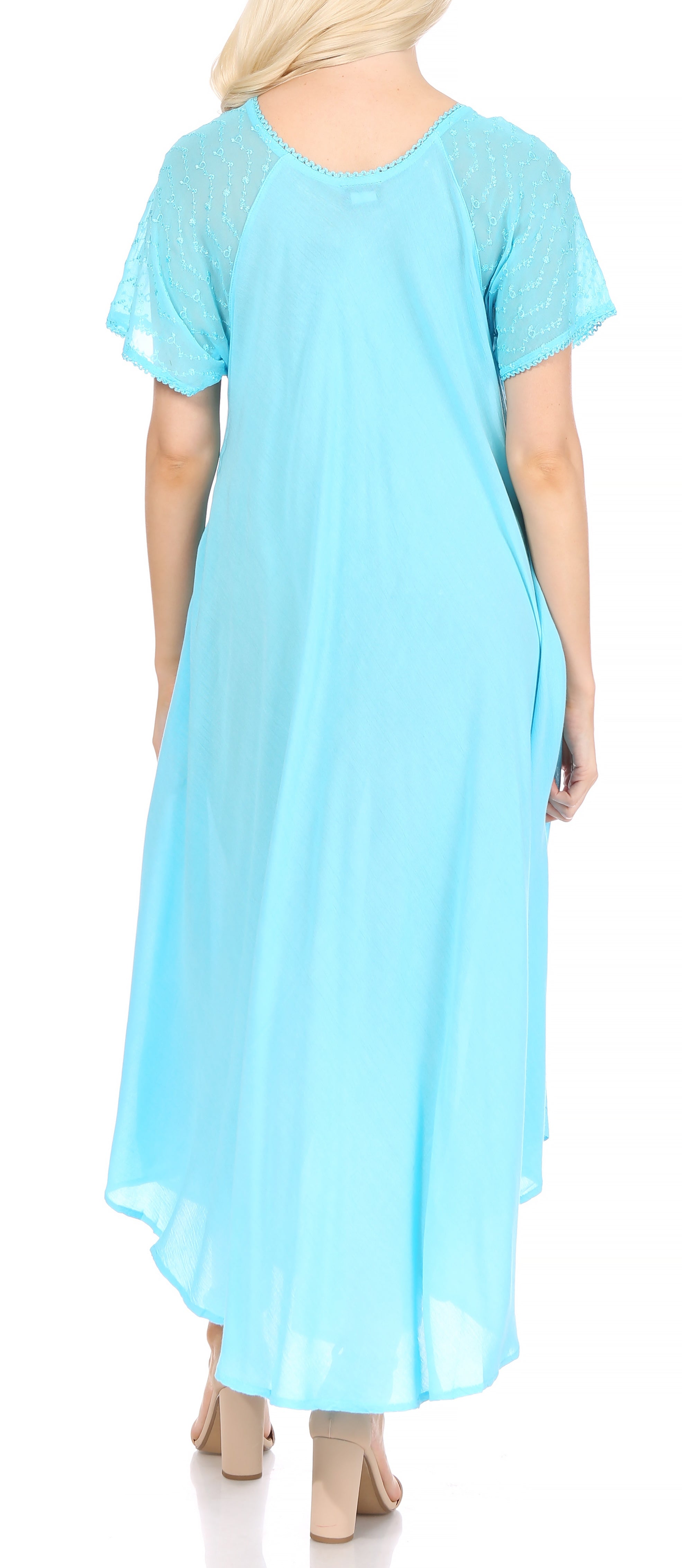 Light blue dress with sheer sleeves worn by a person on a white background