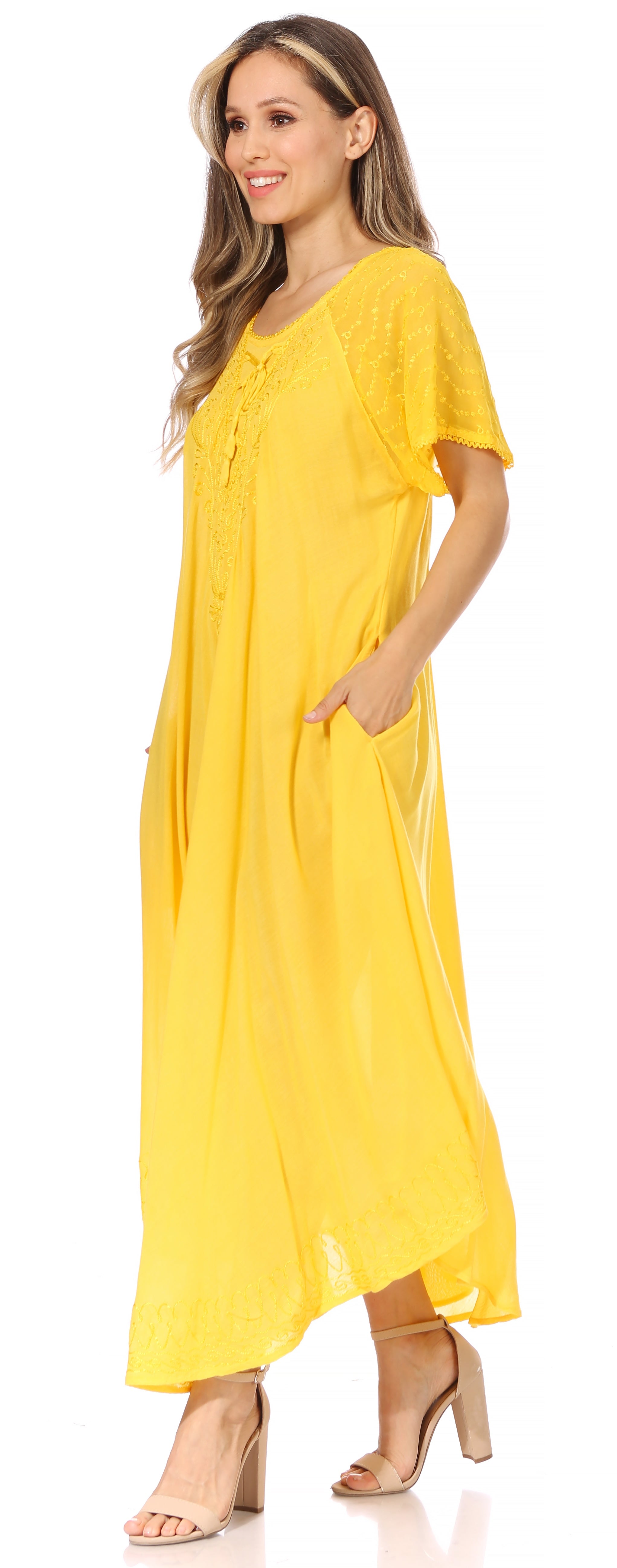 Woman wearing a yellow dress on a white background