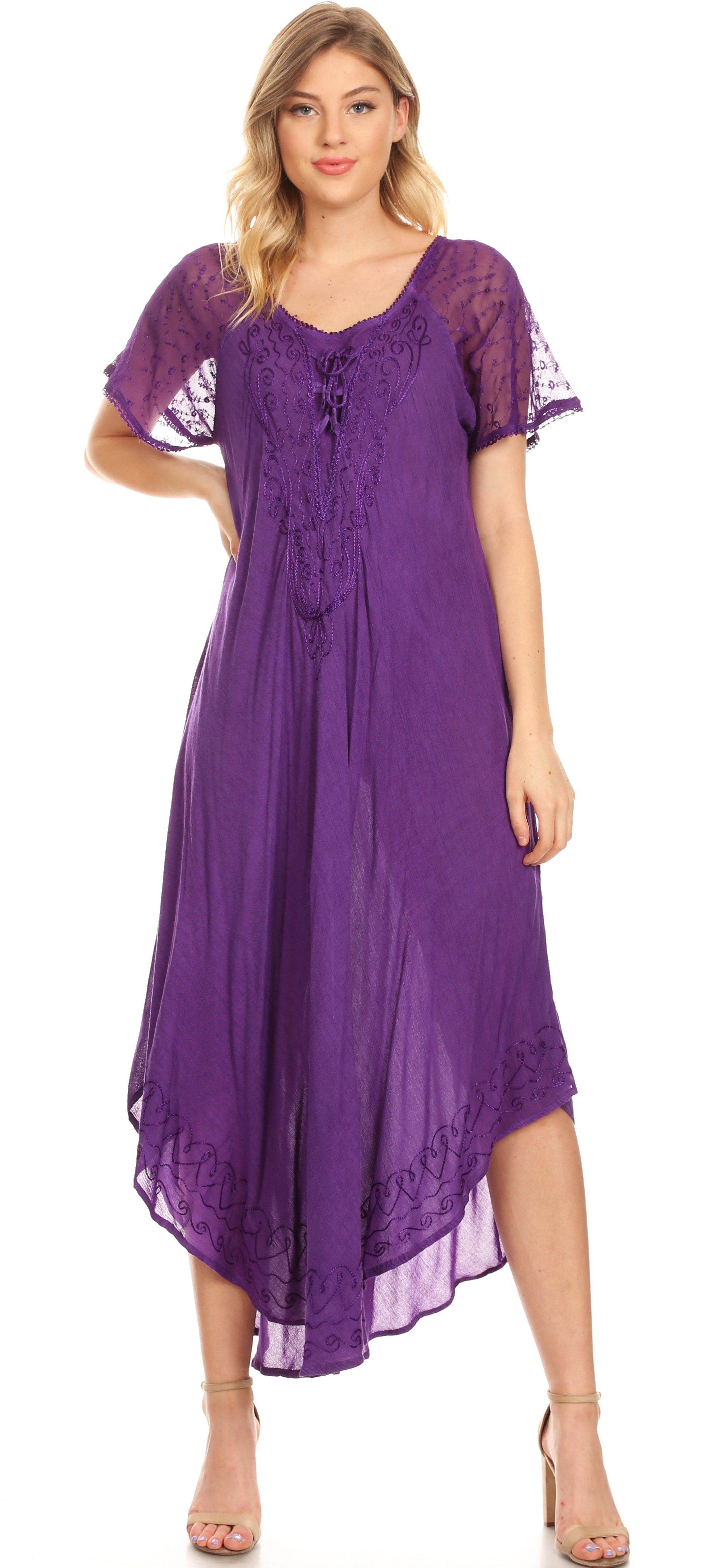 Woman wearing a purple dress with lace sleeves on a white background