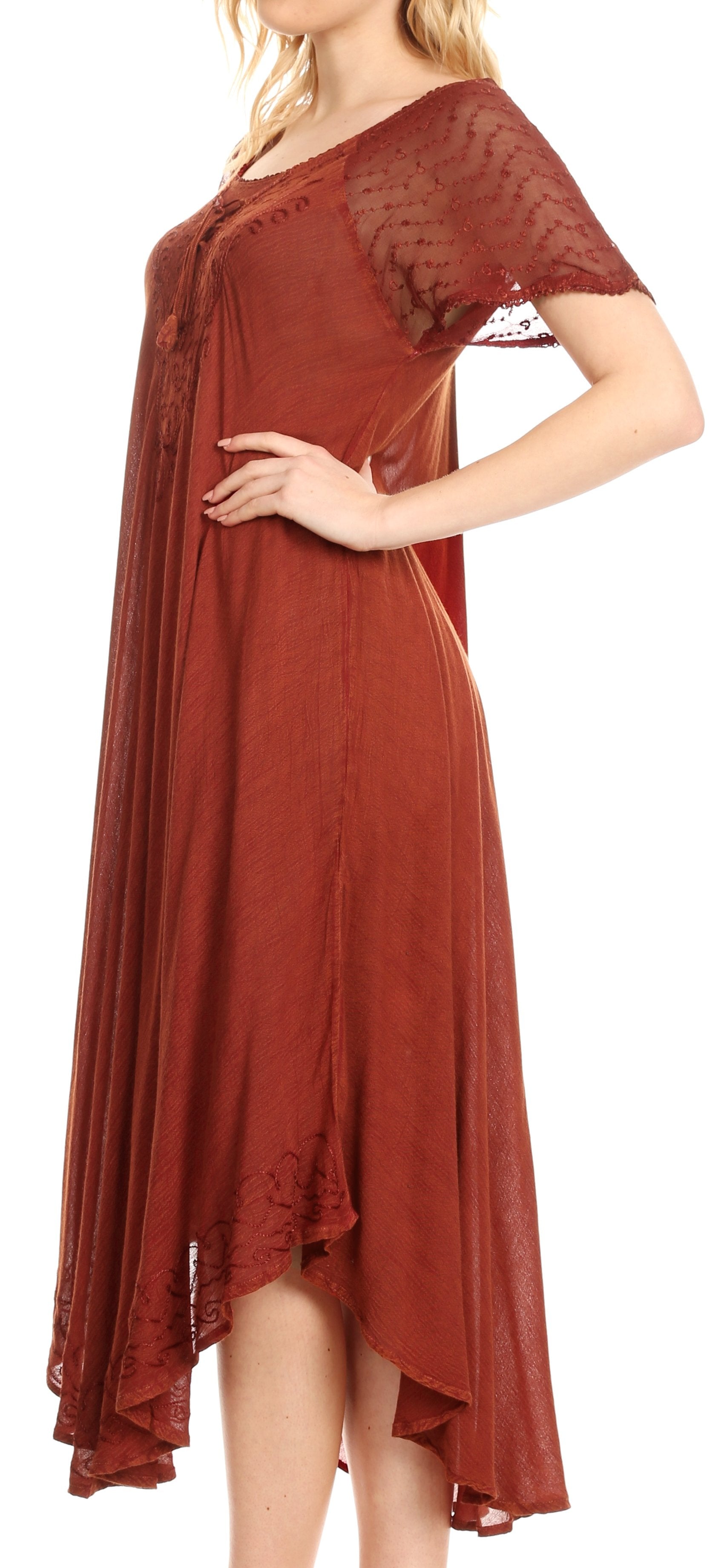 Woman wearing a rust-colored dress with a lace overlay on a white background