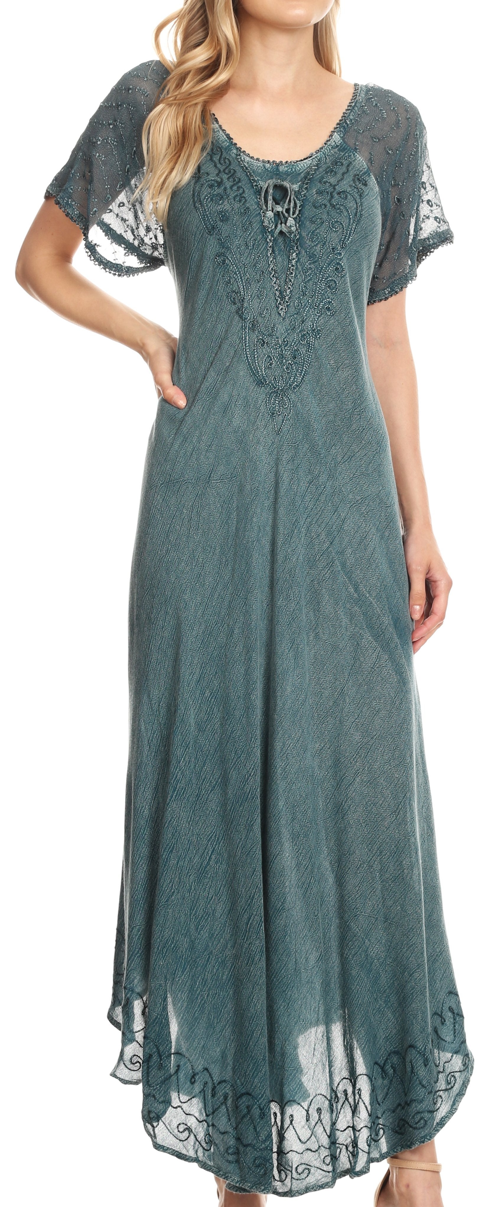 Woman wearing a teal lace dress with short sleeves.