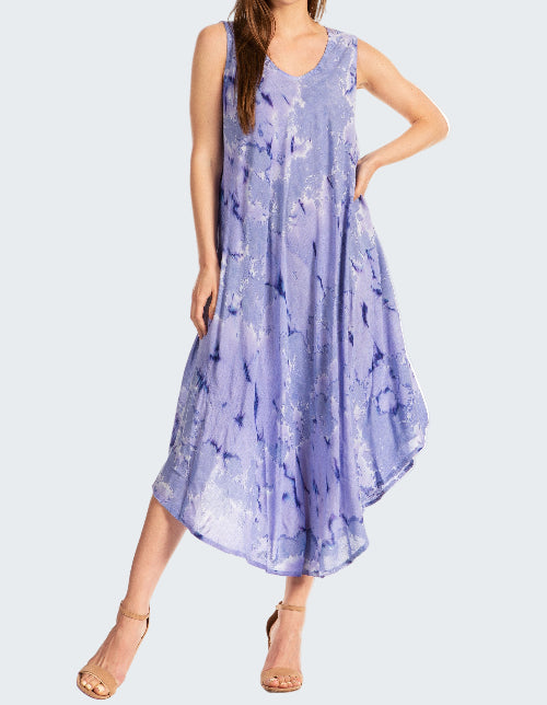 Woman wearing a sleeveless, light blue dress with a floral pattern on a white background