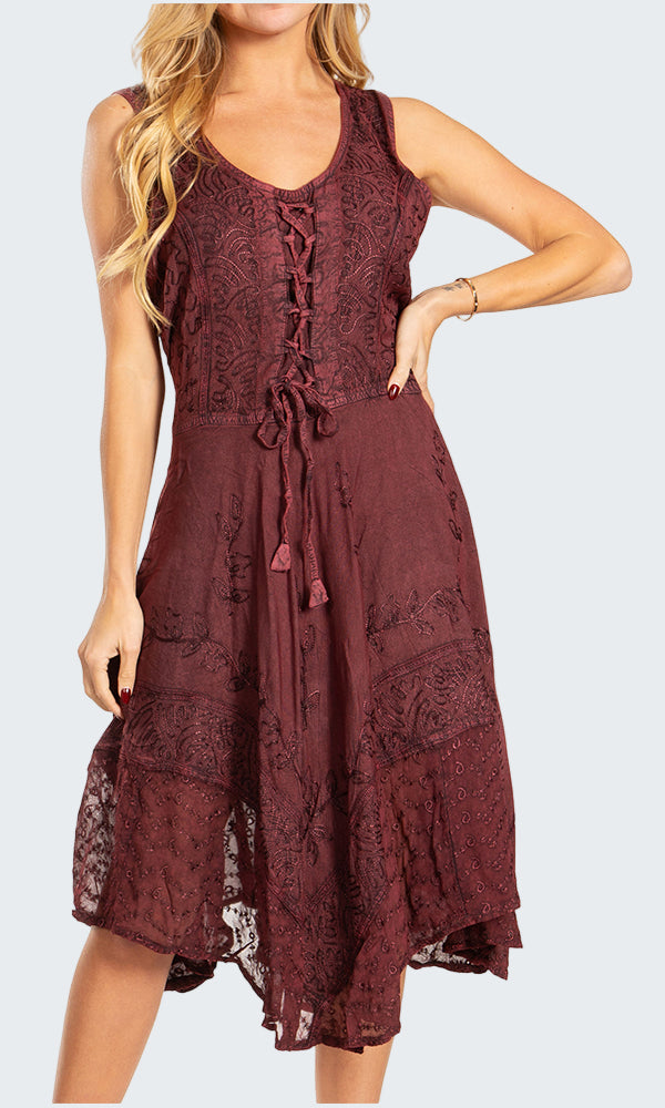 Woman wearing a burgundy lace dress on a white background