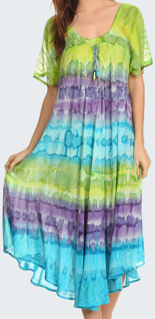 Woman wearing a tie-dye dress with green, purple, and blue gradient.