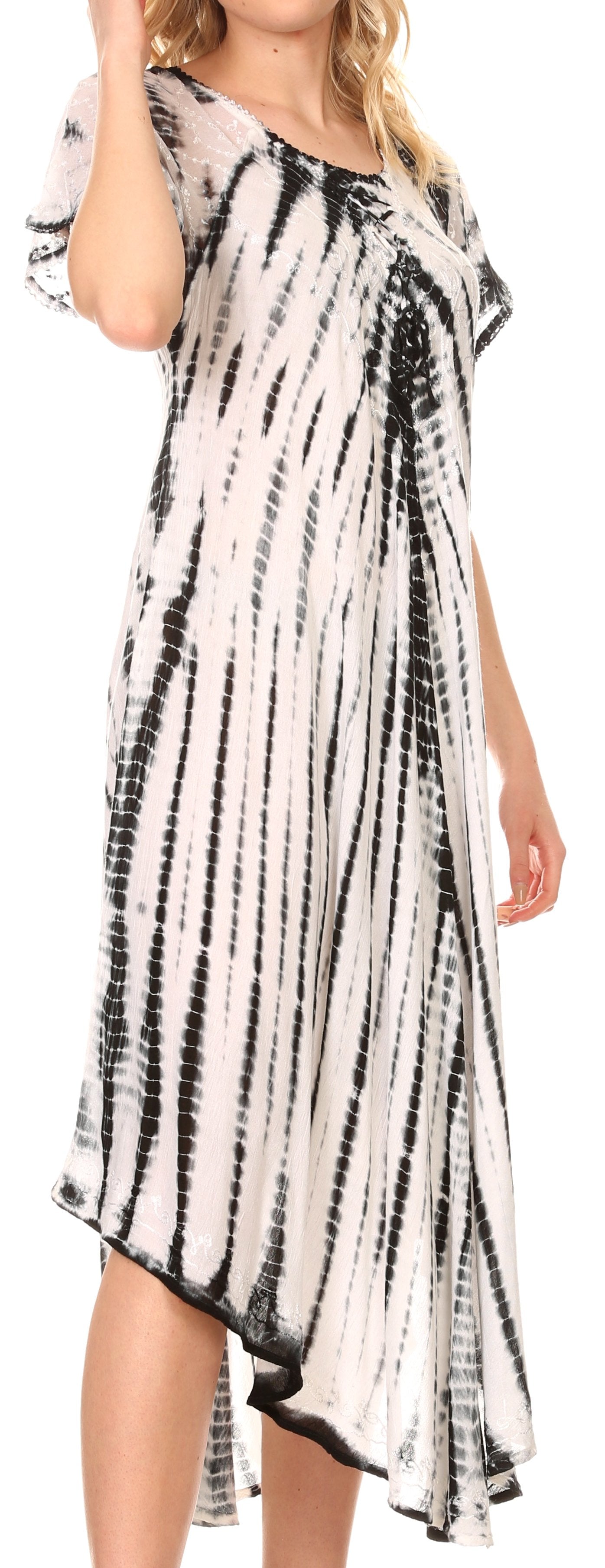 Woman wearing a black and white tie-dye dress.