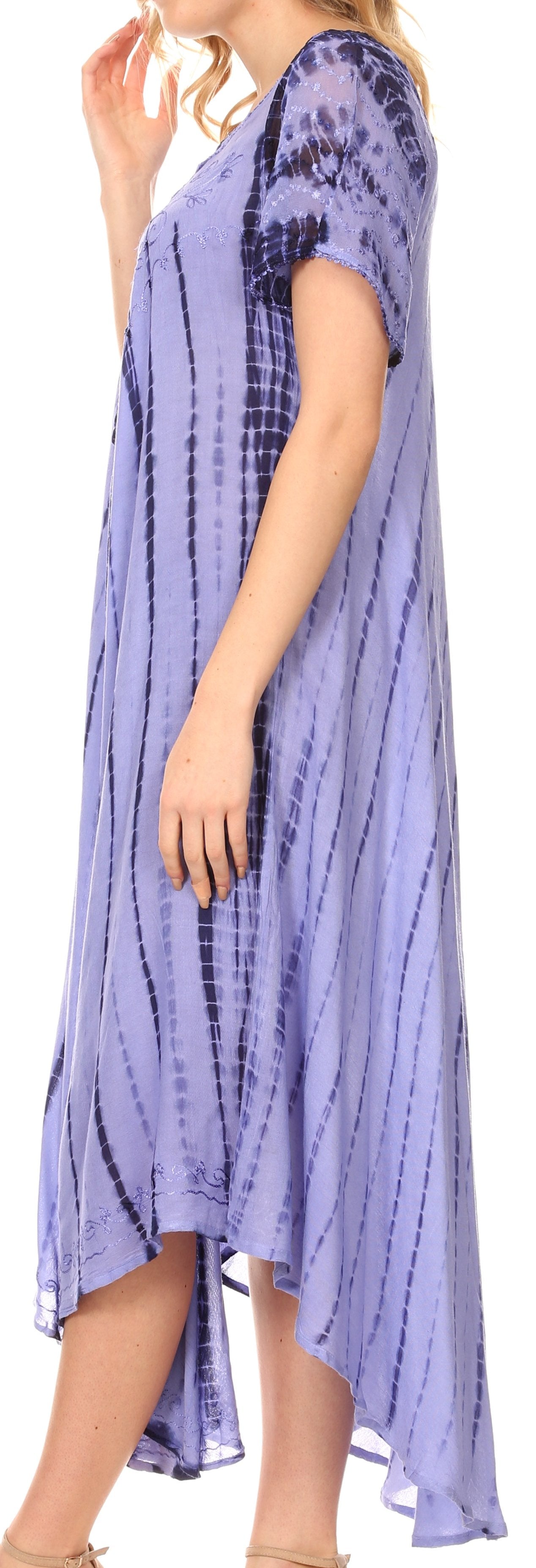 Woman wearing a long, light purple tie-dye dress on a white background
