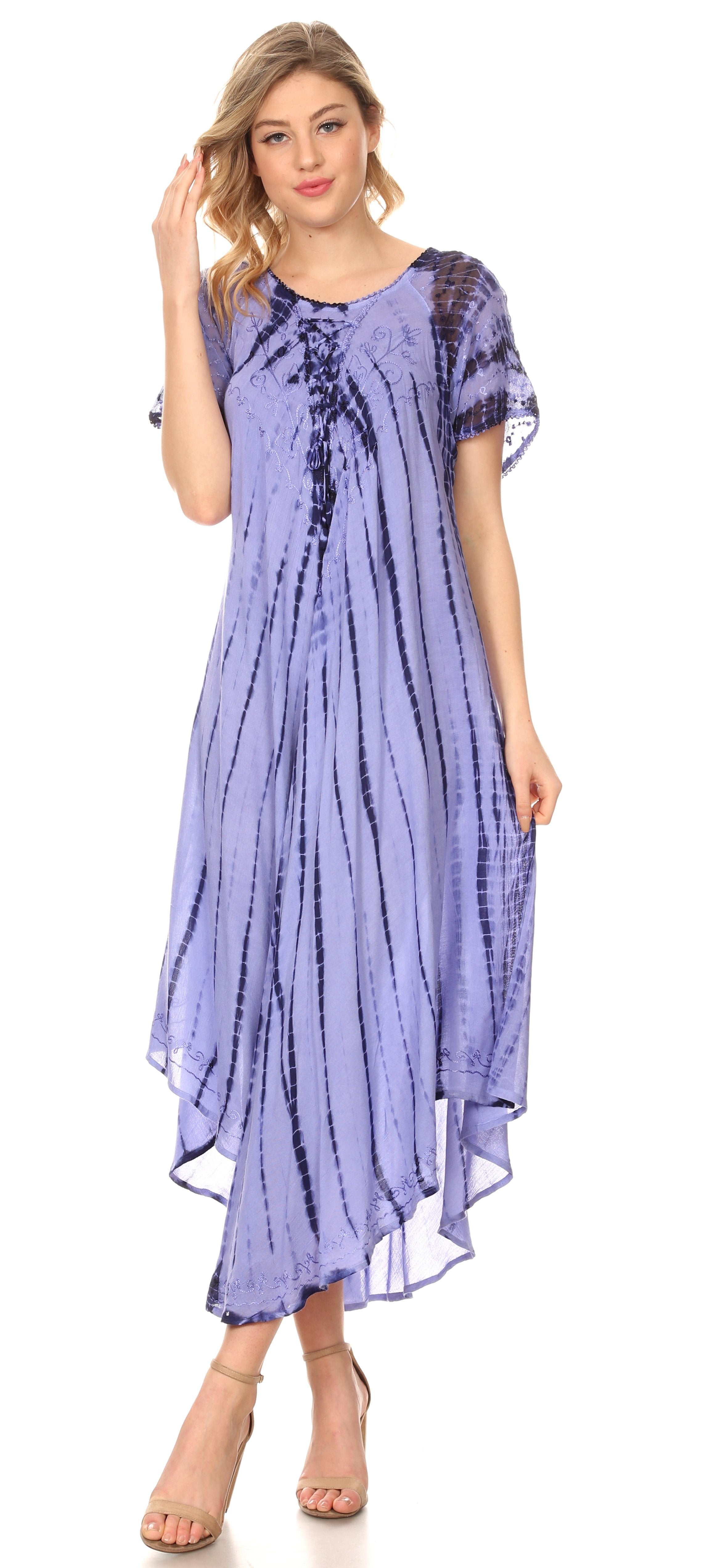 Woman wearing a purple tie-dye dress on a white background