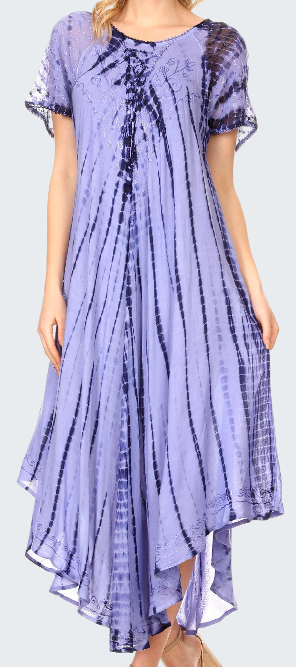 Woman wearing a long, light purple tie-dye dress with a subtle pattern.