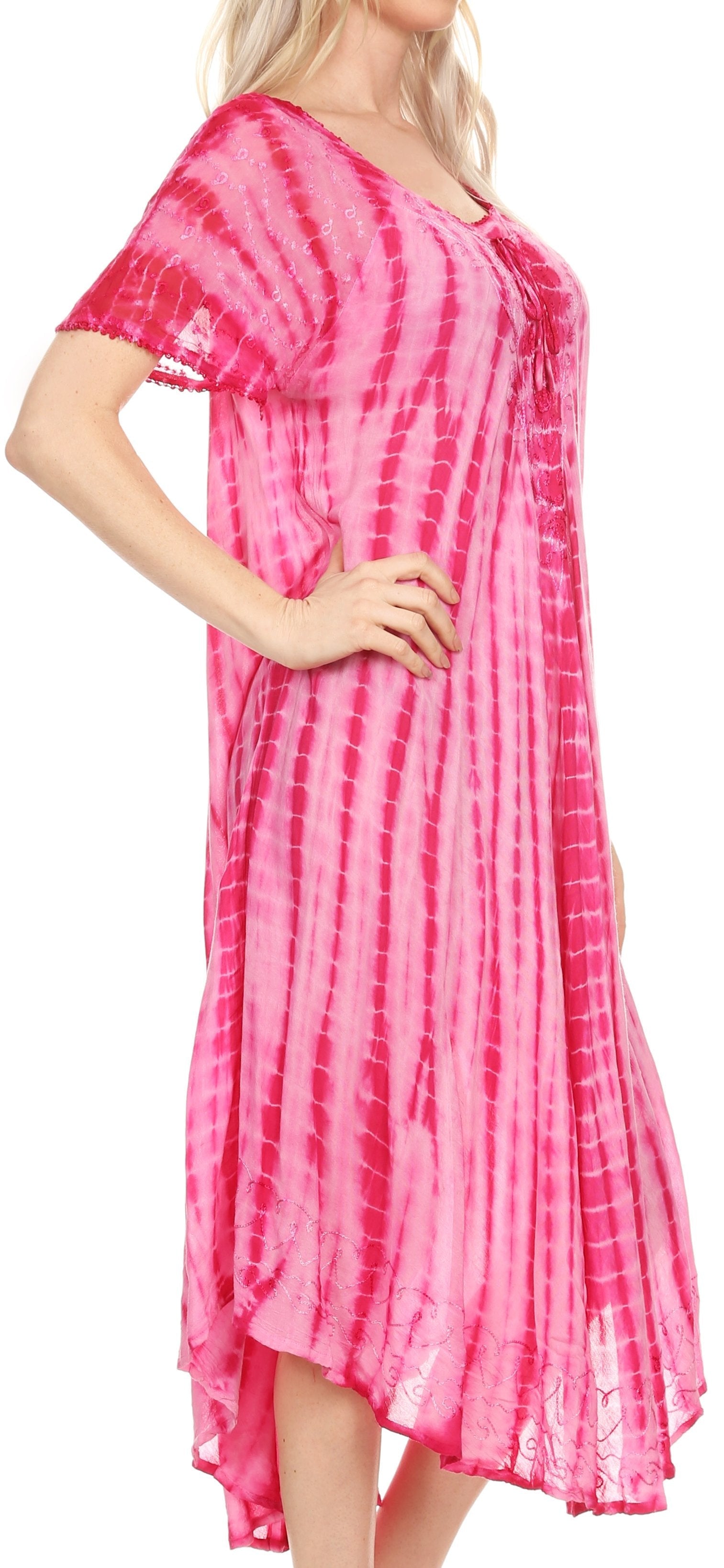 Woman wearing a pink tie-dye dress with a white background