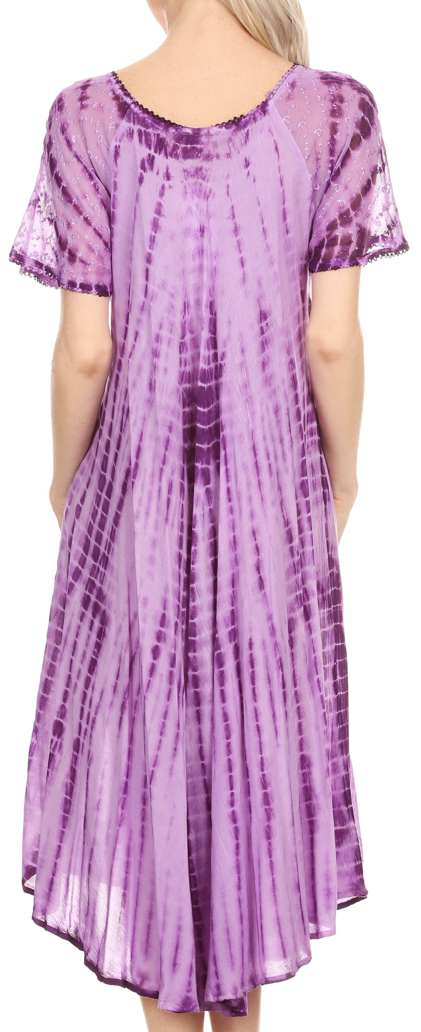 Woman wearing a purple tie-dye dress with short sleeves.