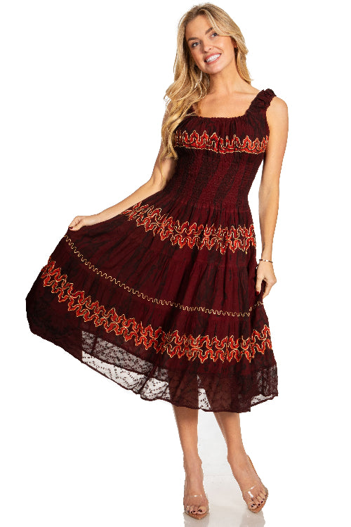 Woman wearing a burgundy dress with red lace details on a white background