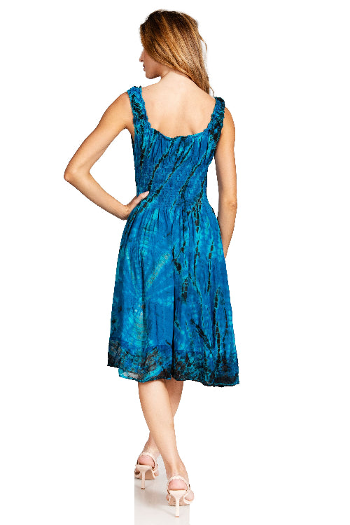 Woman wearing a blue patterned dress on a white background