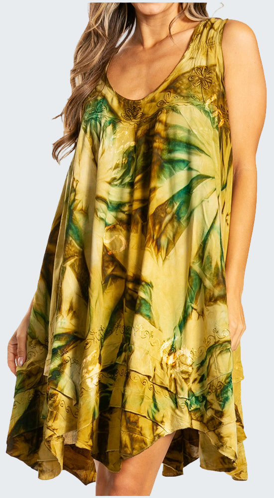 Woman wearing a yellow and green floral dress on a white background