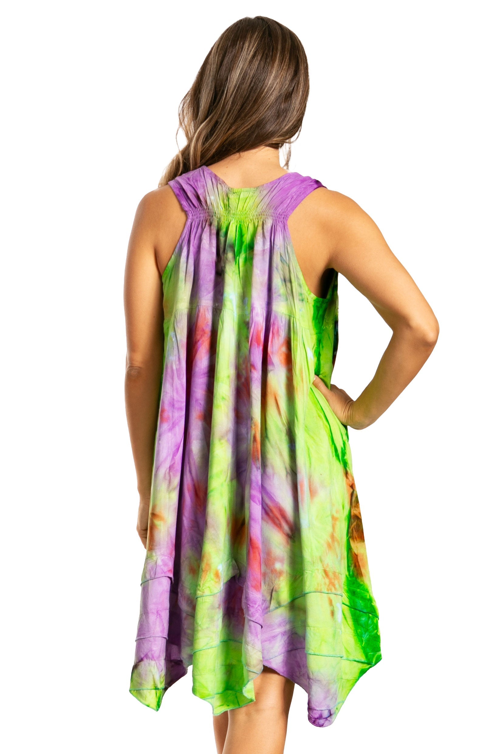 Woman wearing a colorful tie-dye dress with a white background