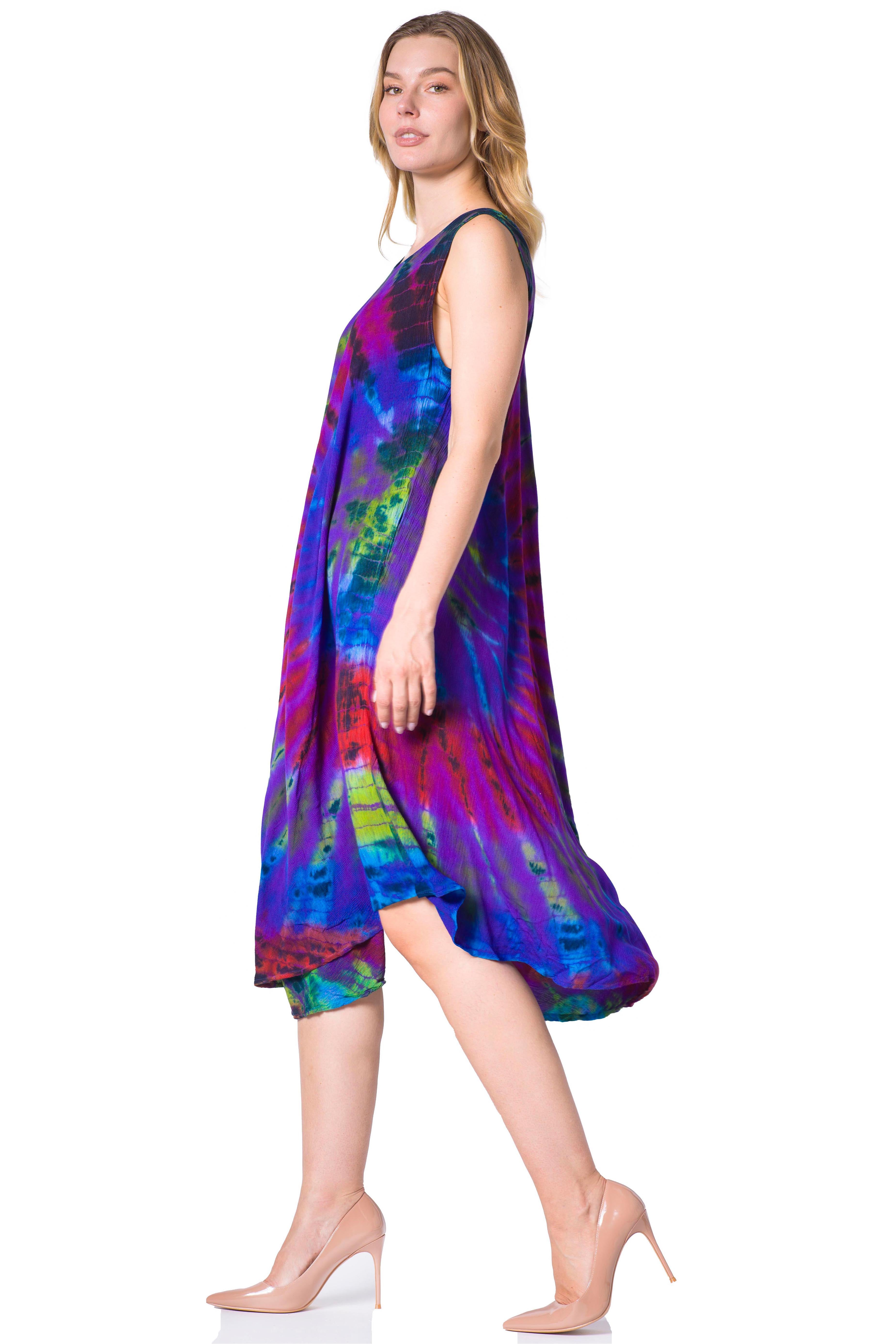 Woman wearing a colorful tie-dye dress on a white background