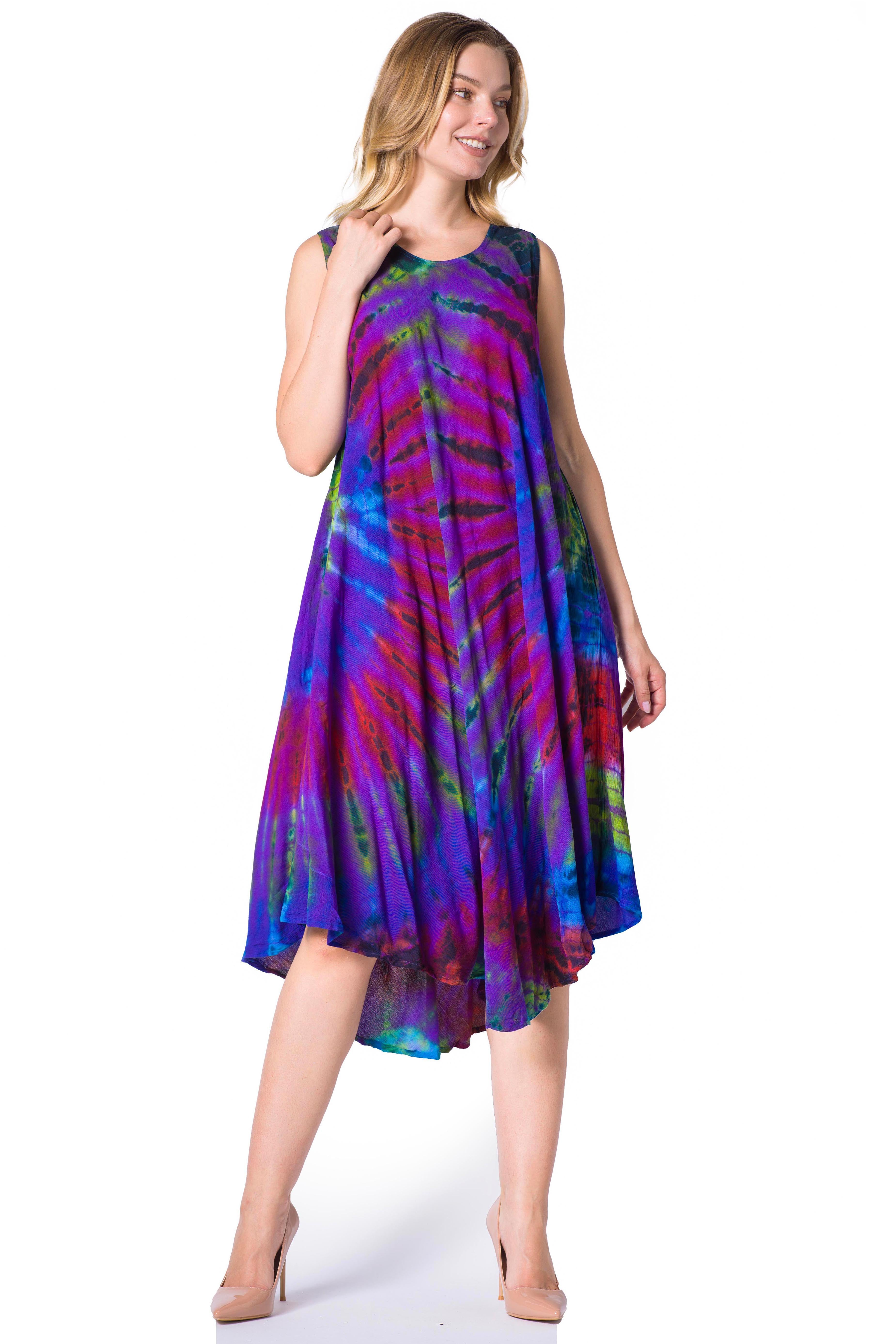 Woman wearing a colorful tie-dye dress on a white background