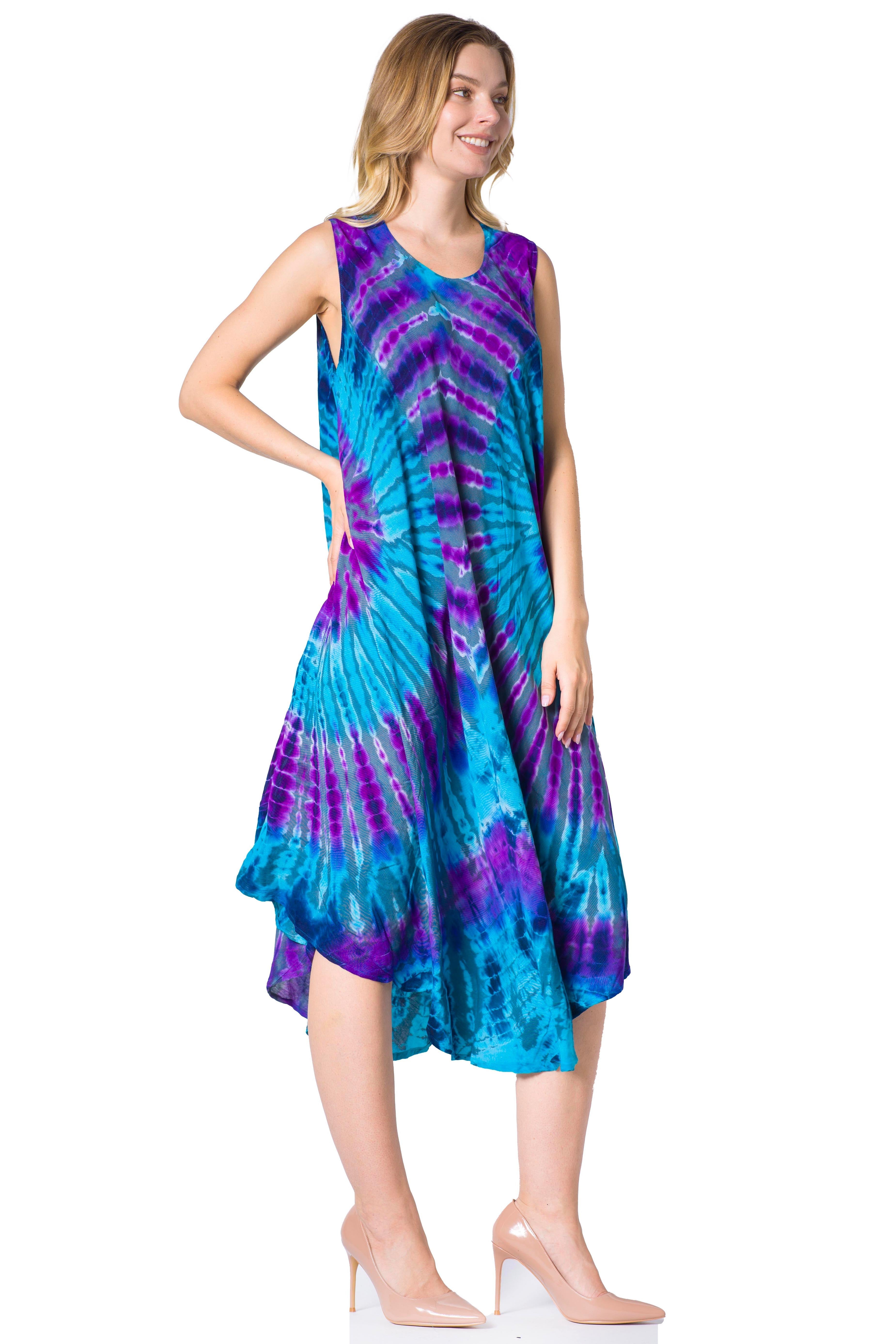 Woman wearing a tie-dye dress with blue and purple patterns on a white background