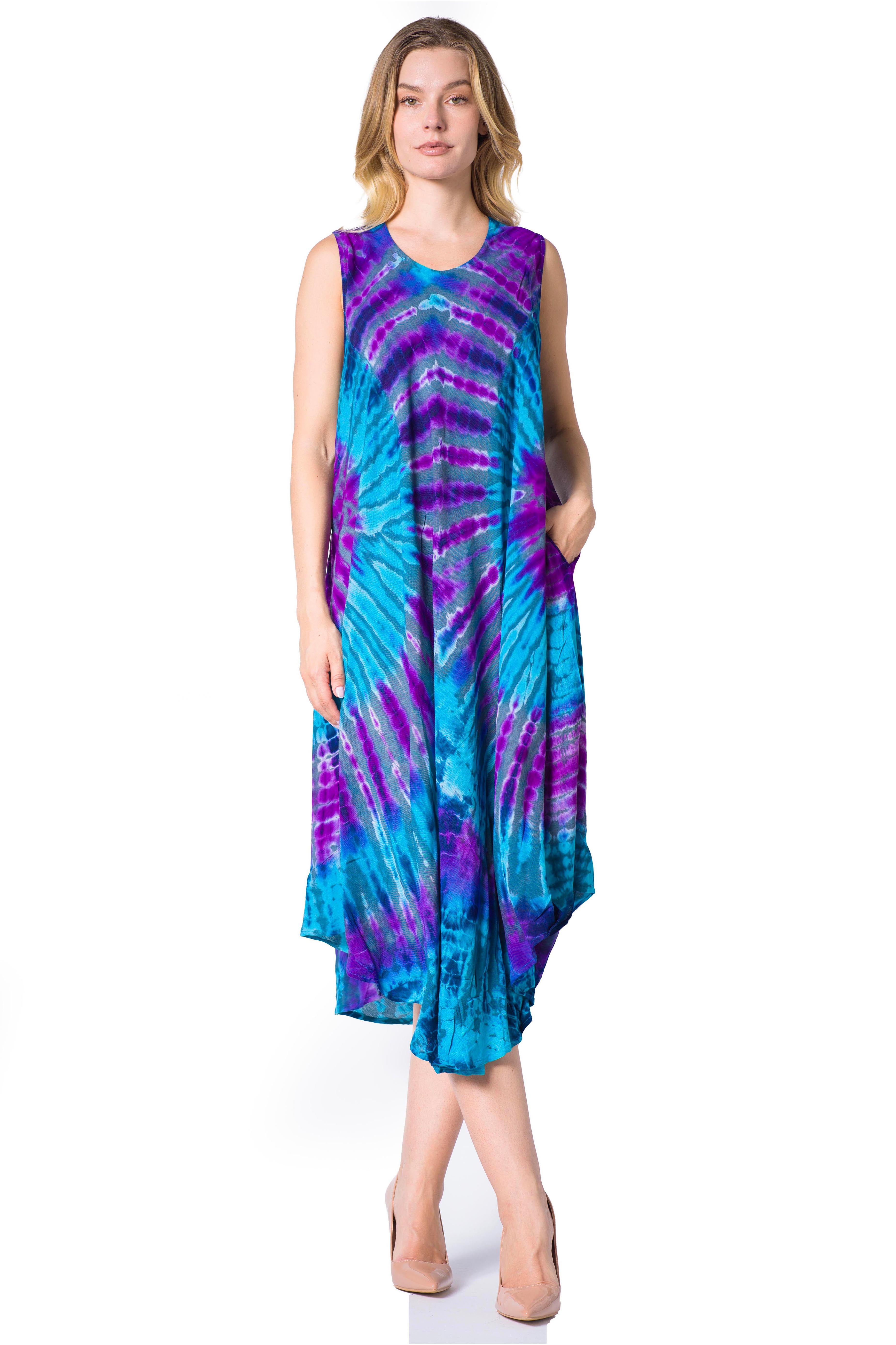 Woman wearing a tie-dye dress with blue and purple patterns on a white background