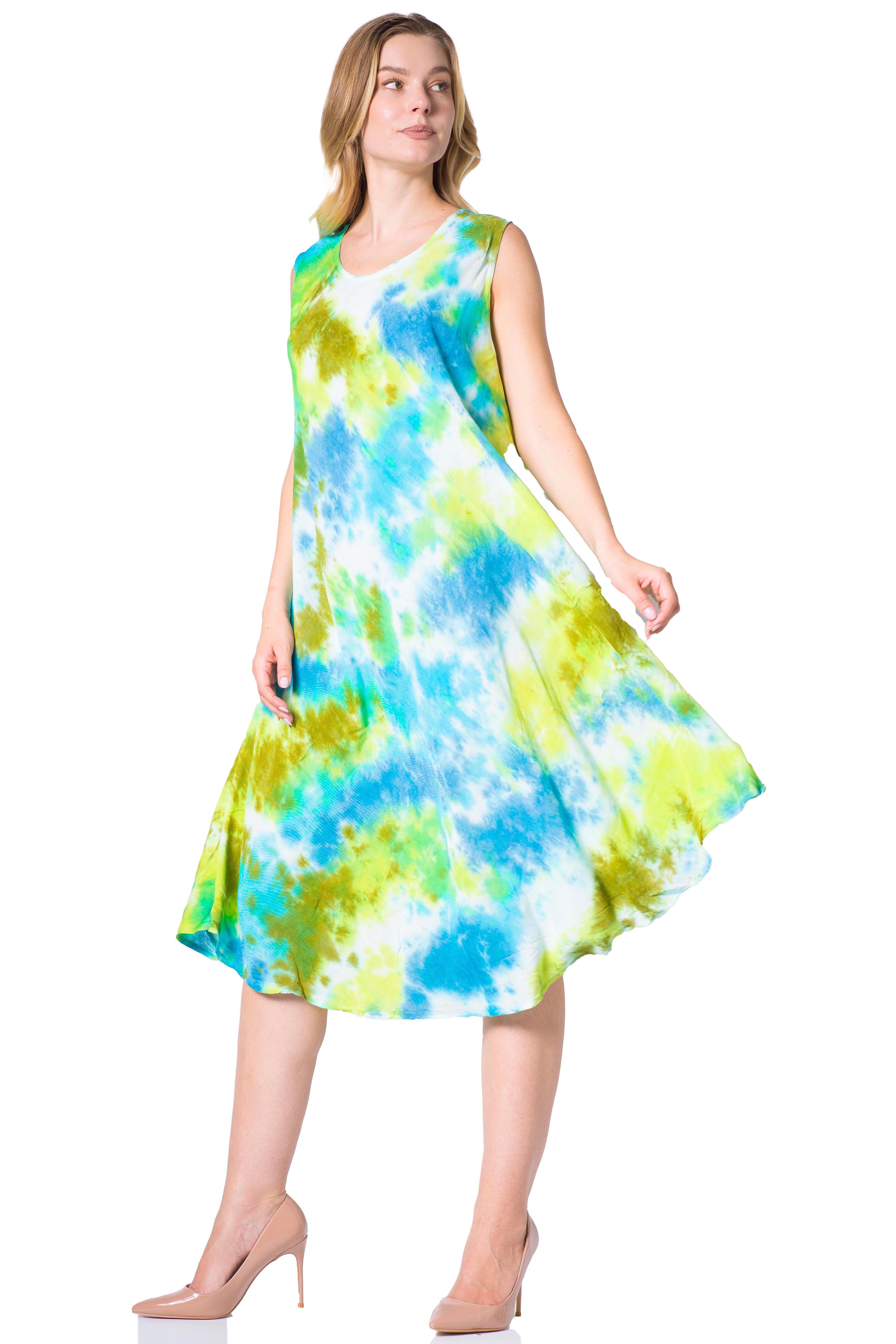 Woman wearing a tie-dye dress with blue and green patterns on a white background
