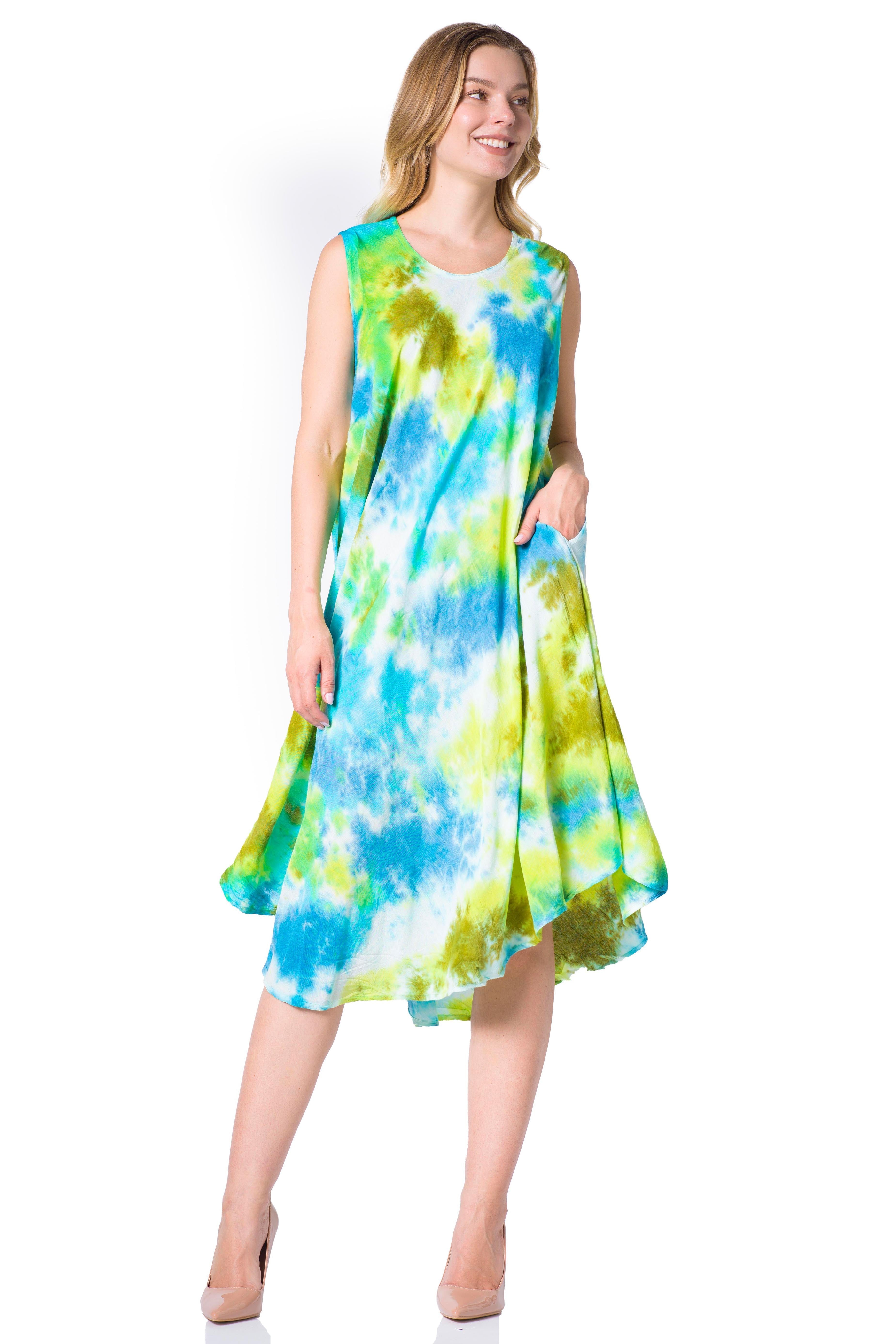 Woman wearing a tie-dye dress with blue and green patterns on a white background