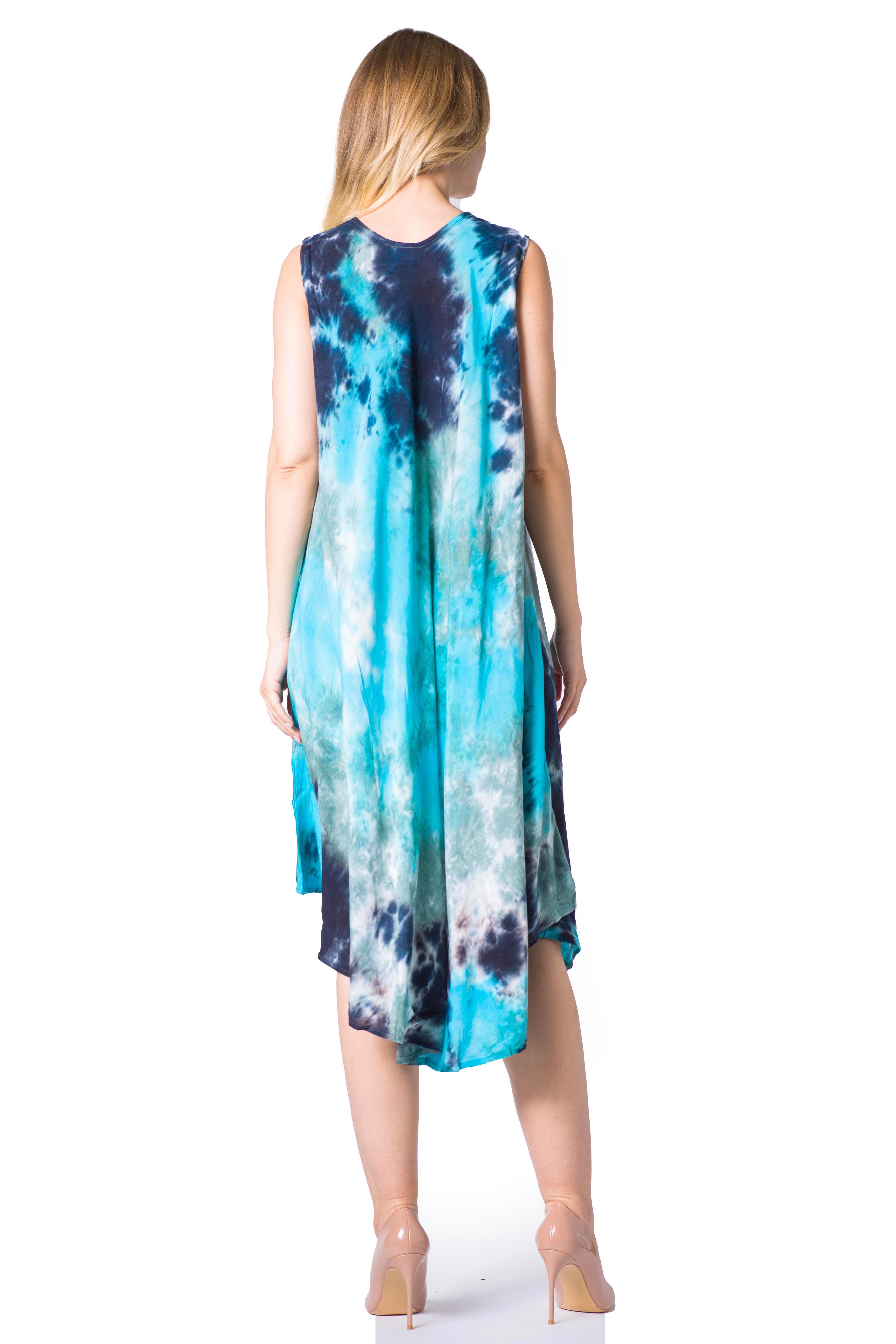 Woman wearing a sleeveless dress with blue and green tie-dye pattern on a white background