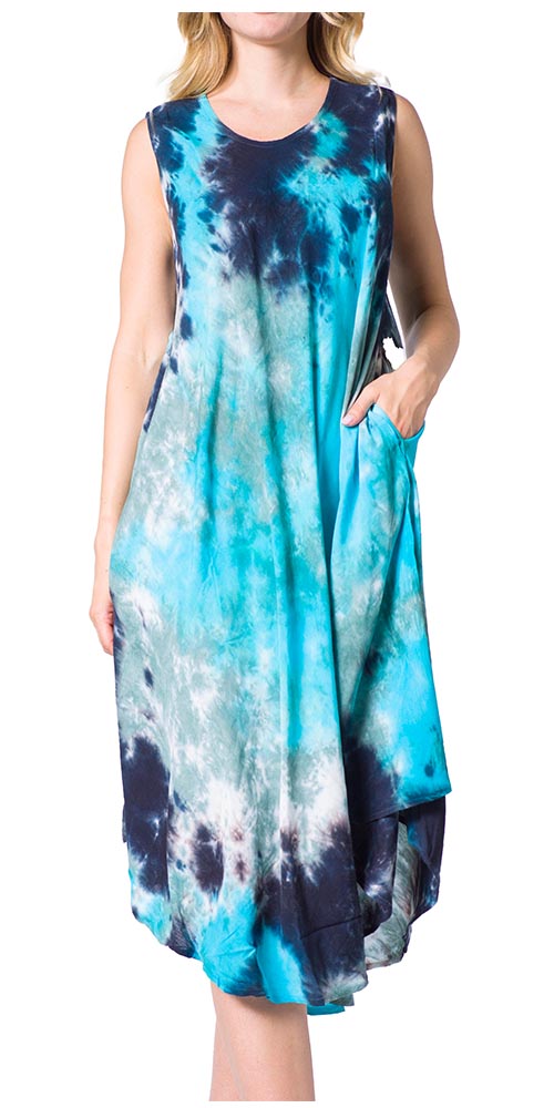 Woman wearing a tie-dye dress with blue and black patterns on a white background