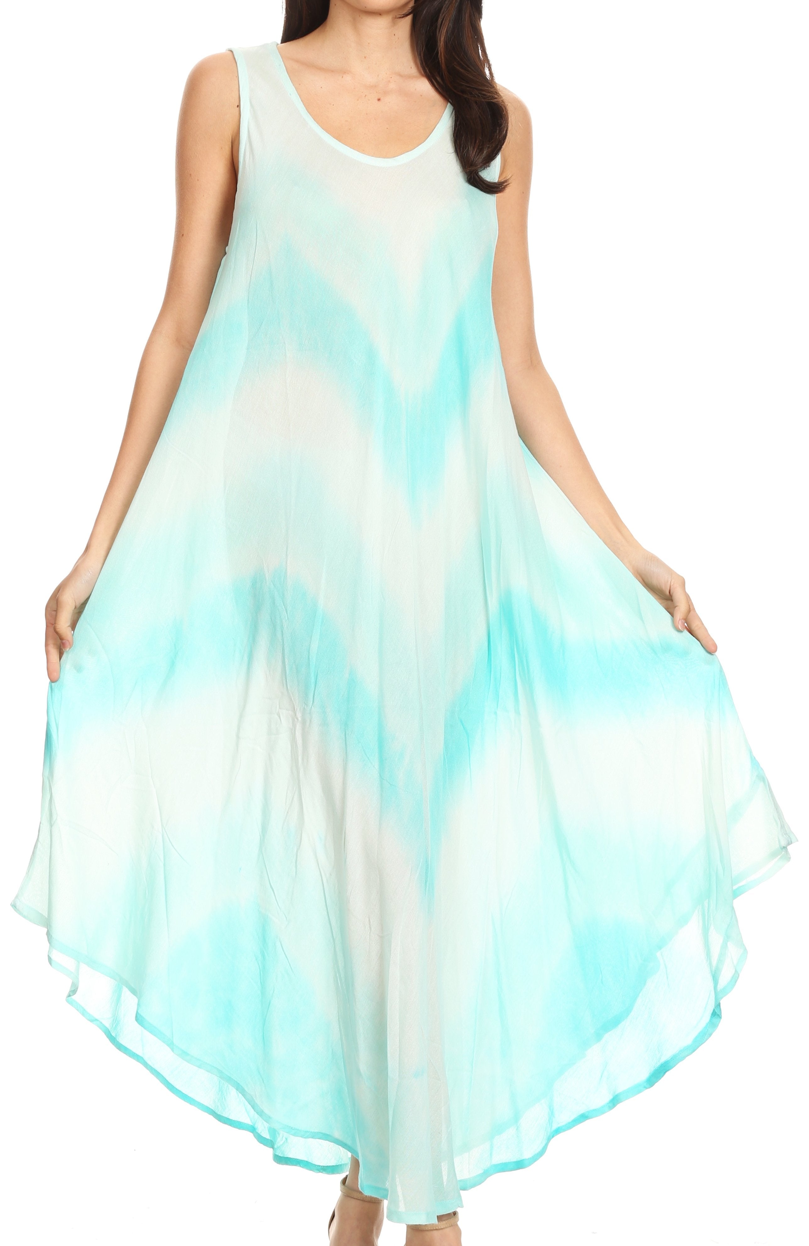 Woman wearing a sleeveless dress with a gradient of blue and white on a white background