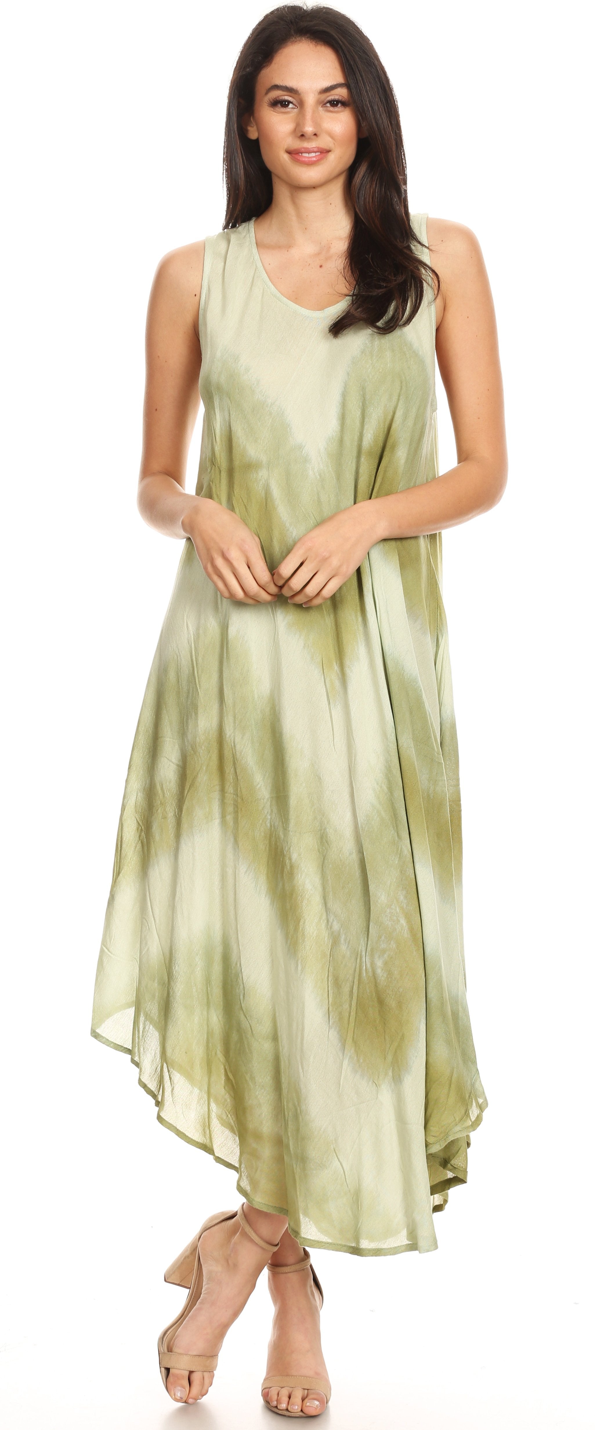 Woman wearing a green tie-dye dress on a white background