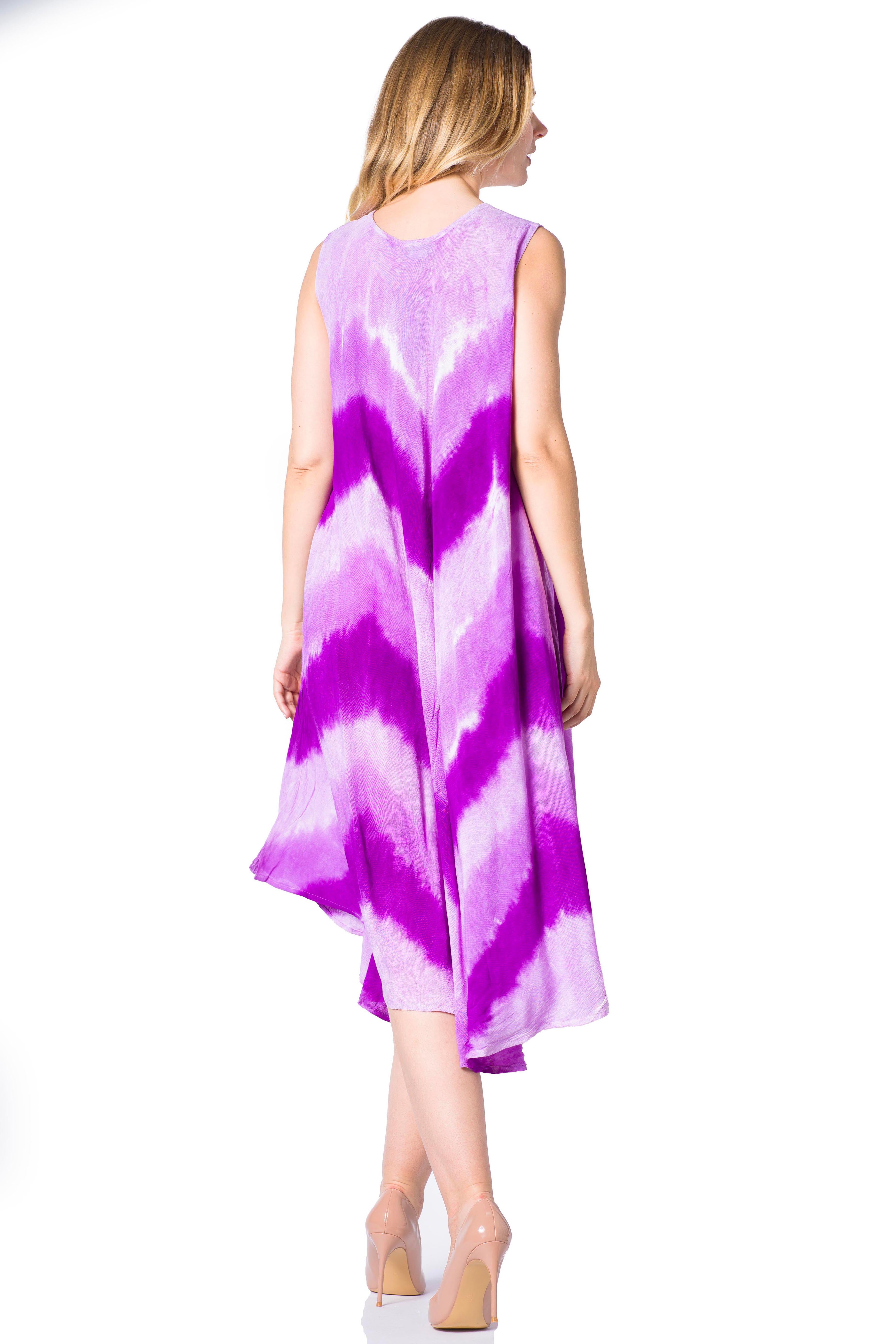 Woman wearing a sleeveless dress with a purple and white tie-dye pattern on a white background