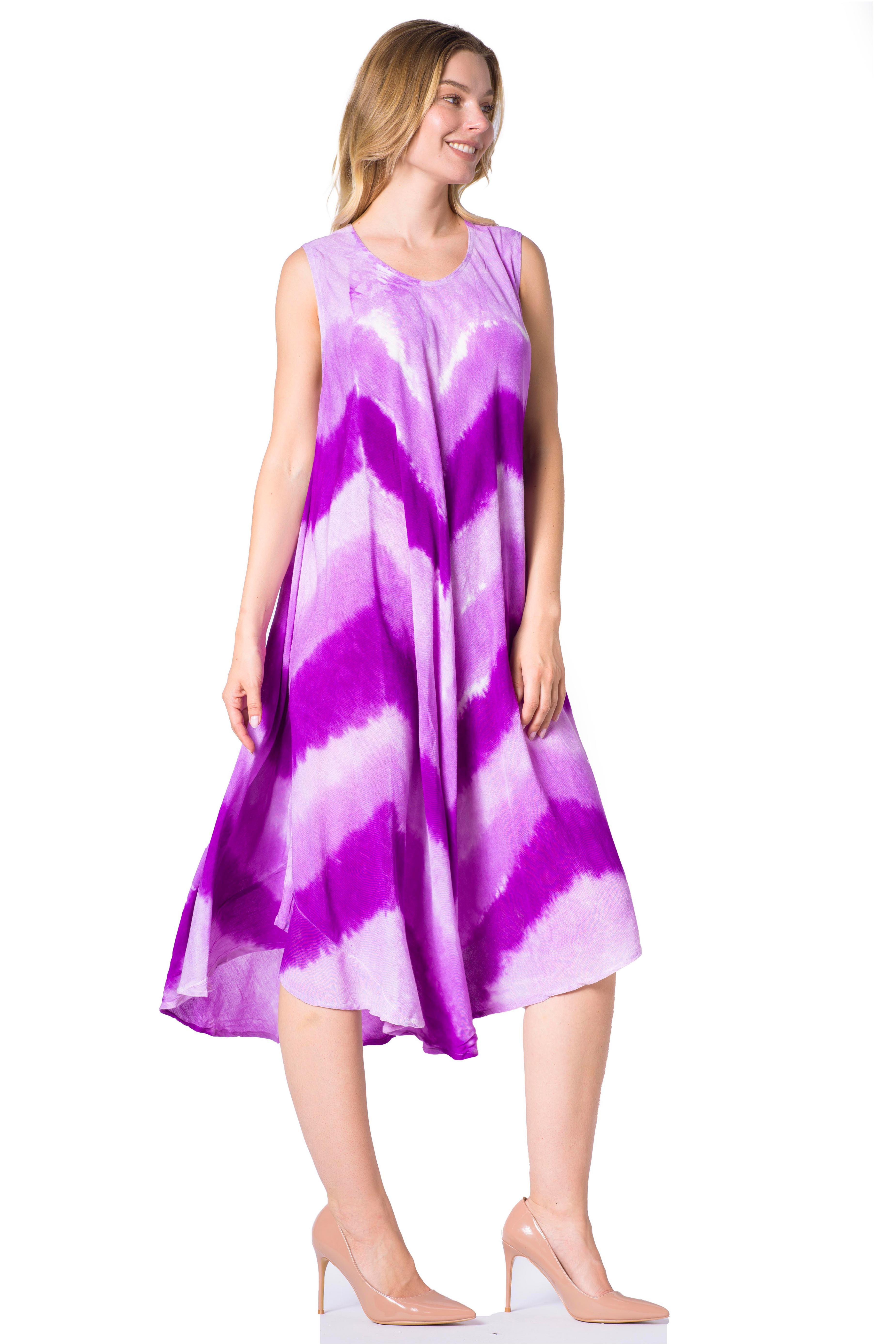 Woman wearing a sleeveless purple and white dress on a white background