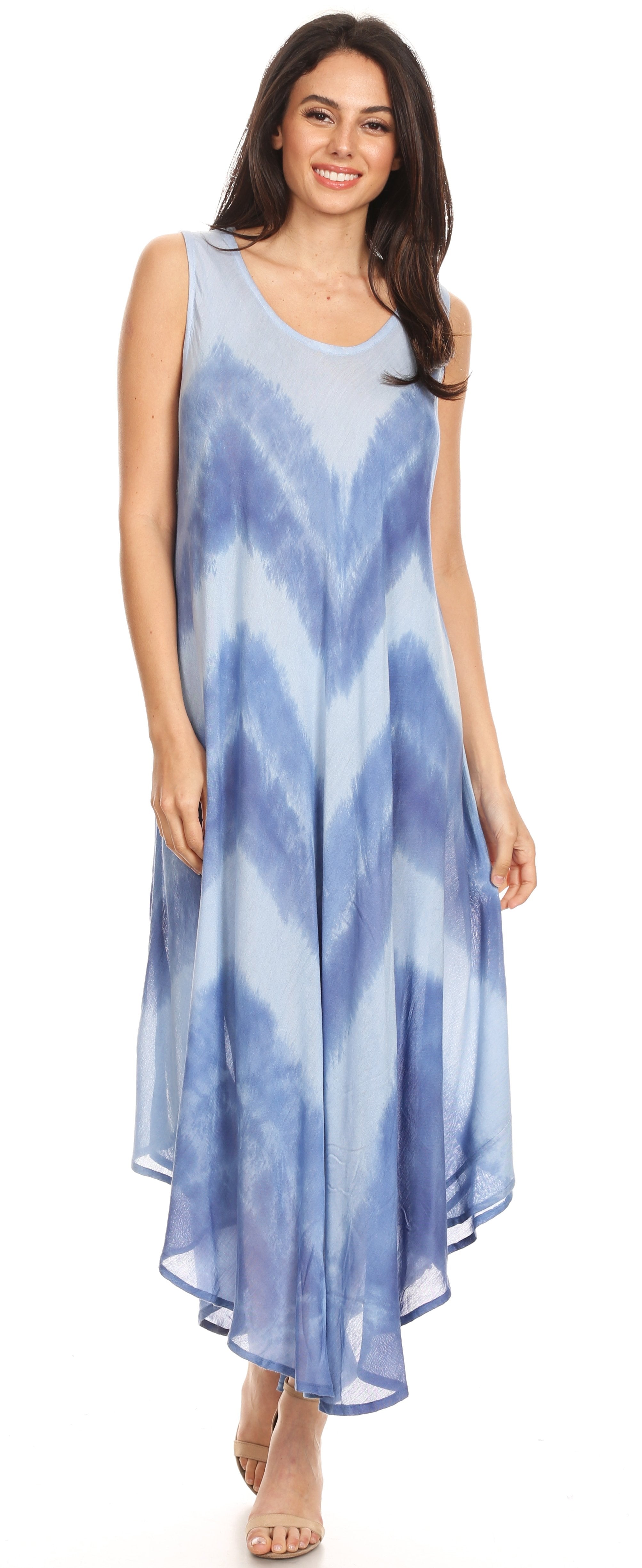 Woman wearing a blue tie-dye dress on a white background