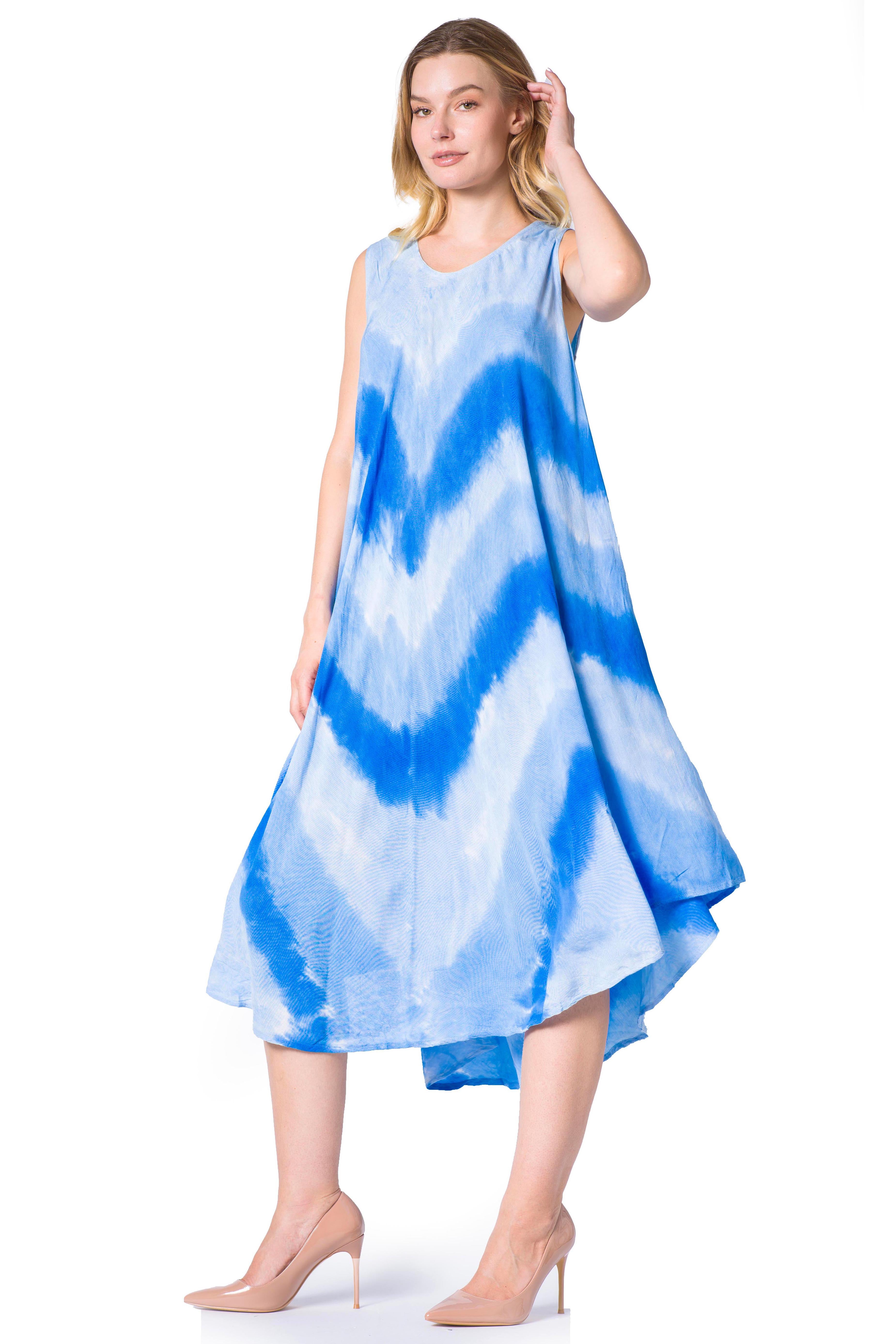 Woman wearing a blue and white tie-dye dress on a white background