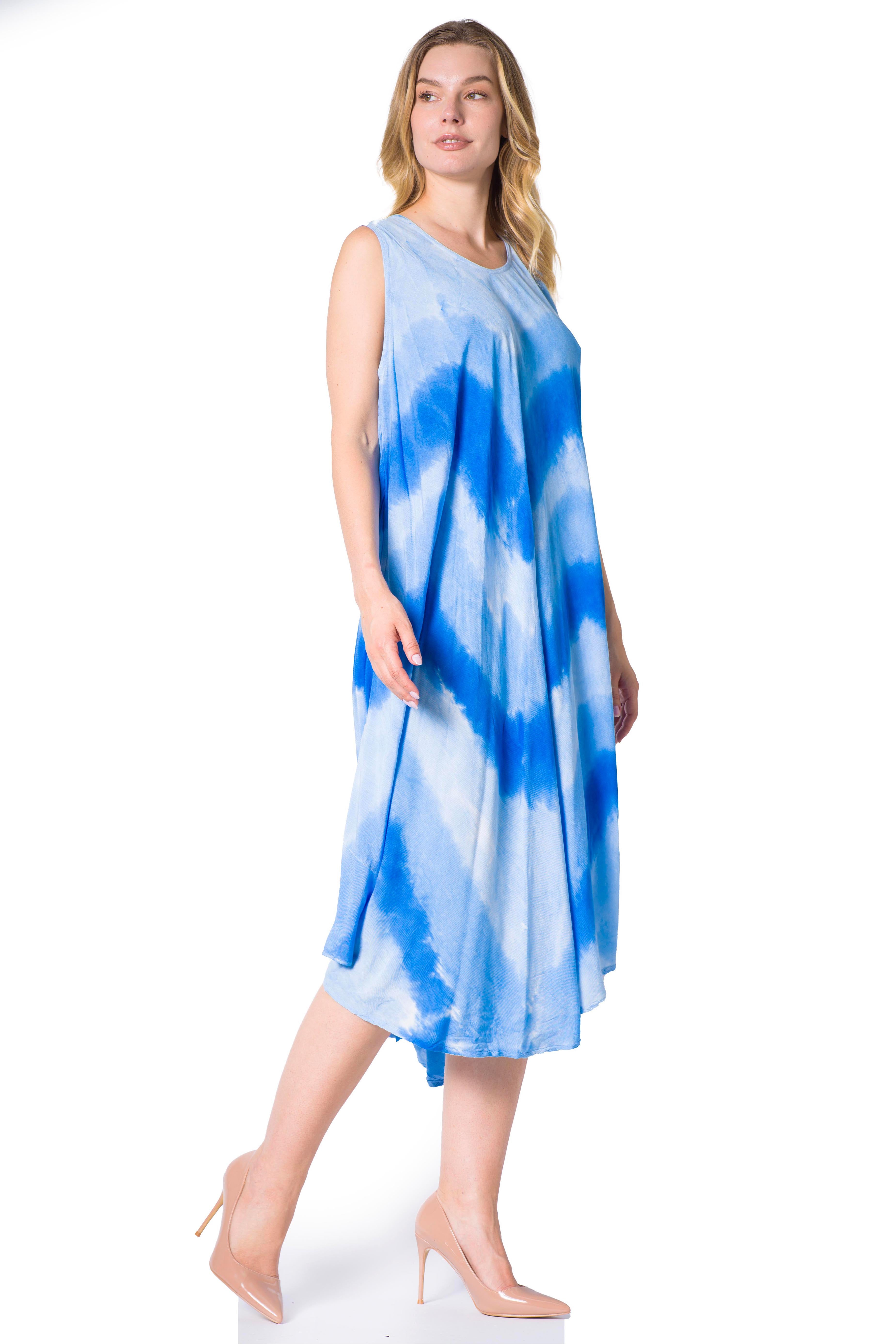 Woman wearing a blue tie-dye dress on a white background