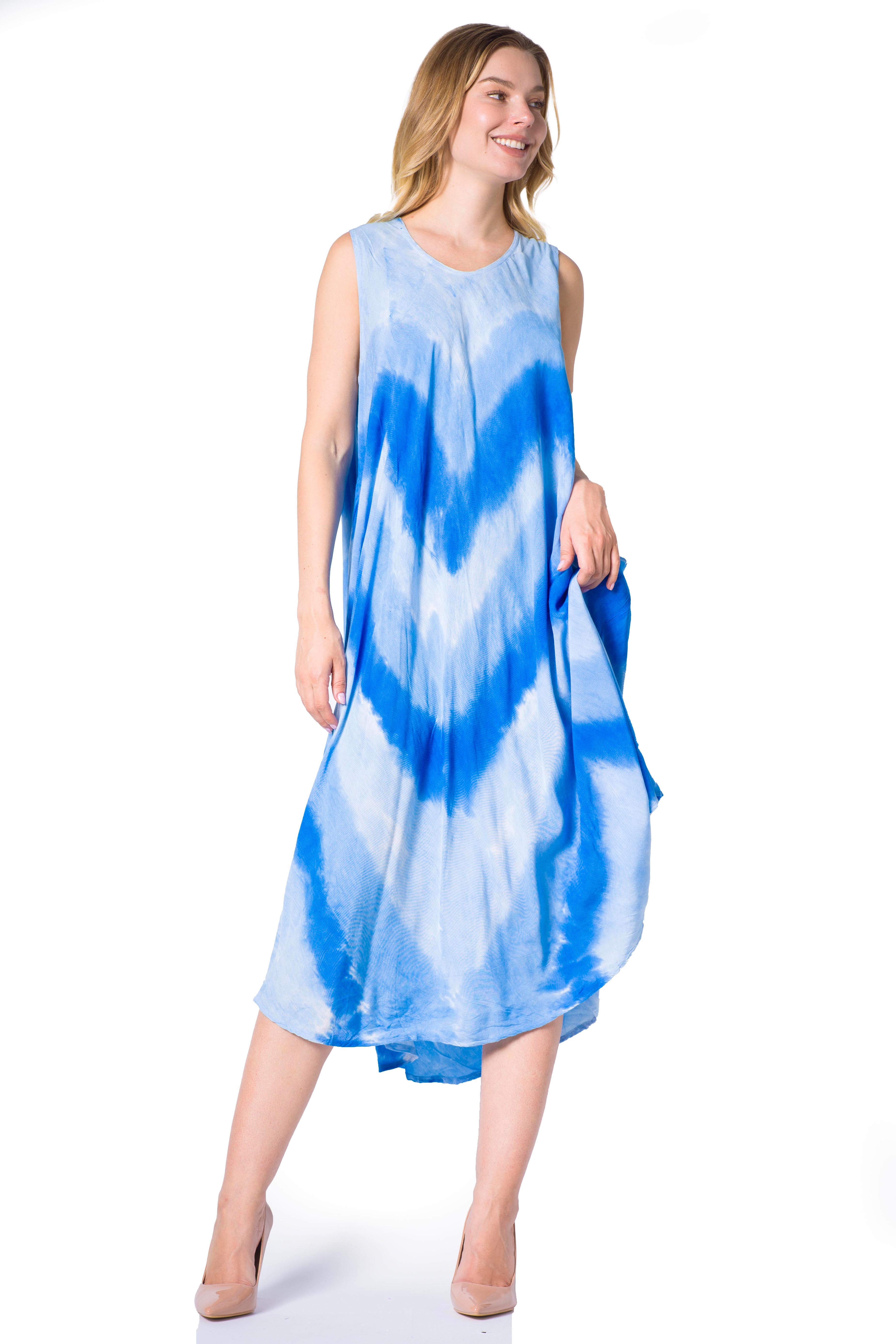 Woman wearing a blue tie-dye dress on a white background