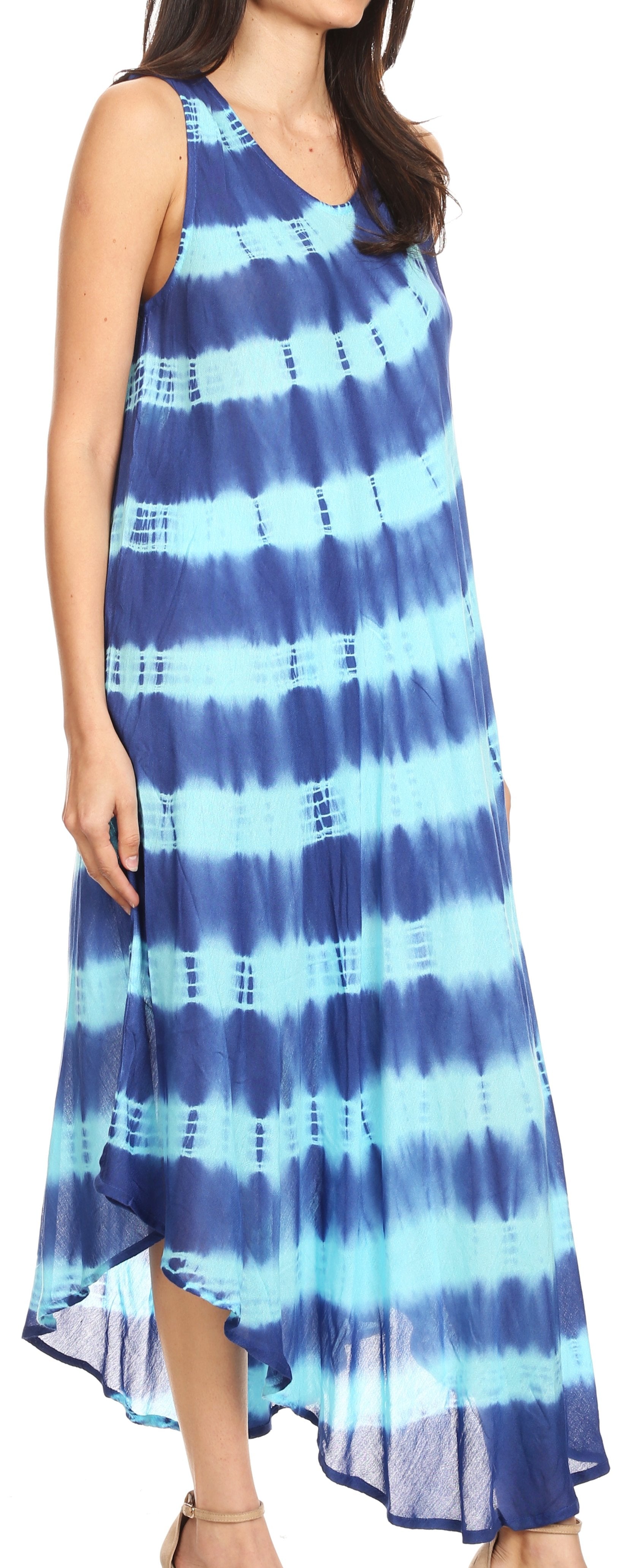 Woman wearing a blue and white tie-dye dress with a high-low hem.