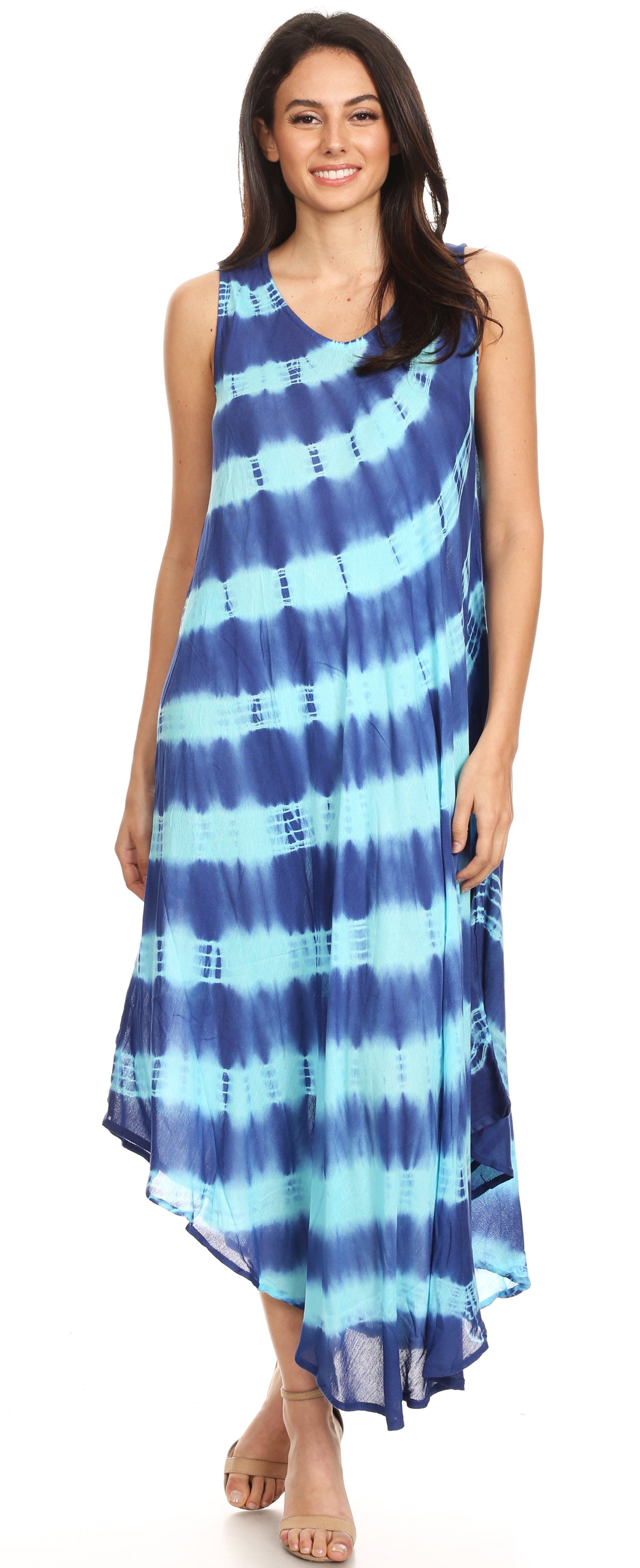Woman wearing a blue tie-dye dress on a white background