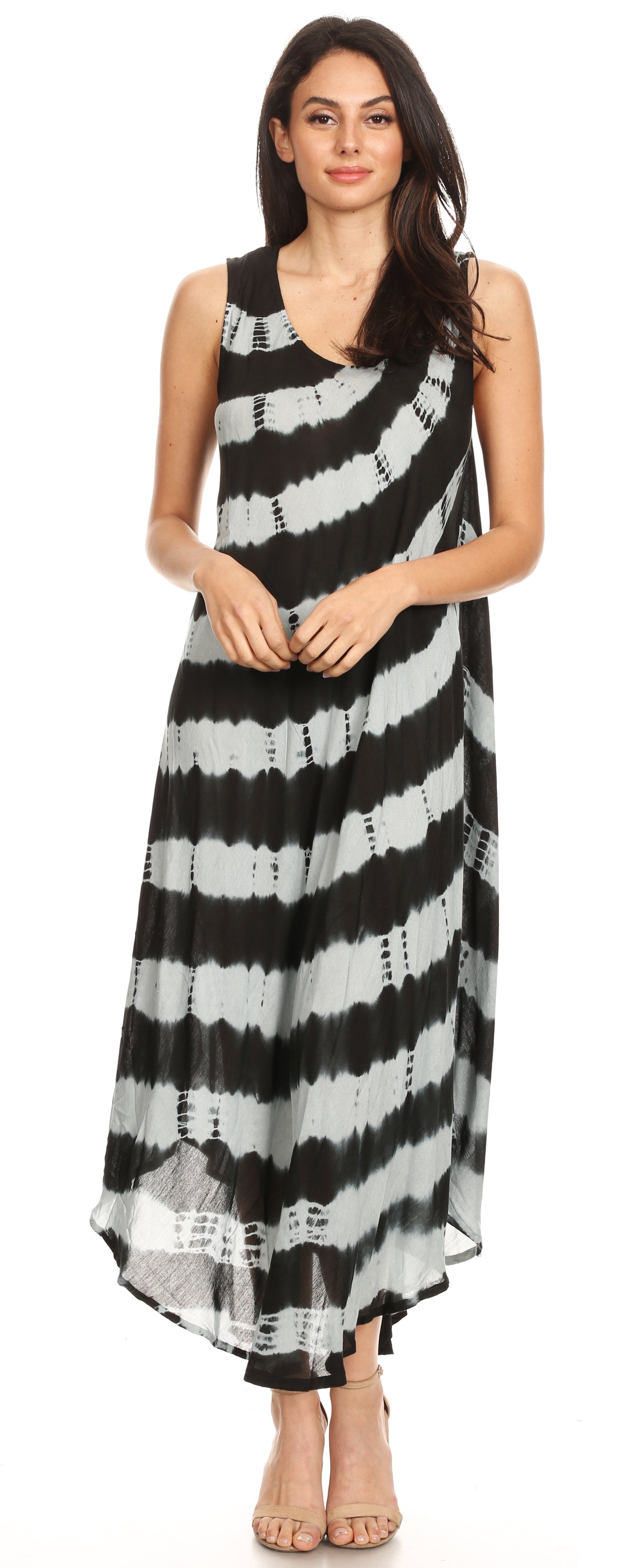 Woman wearing a black and white striped dress on a white background
