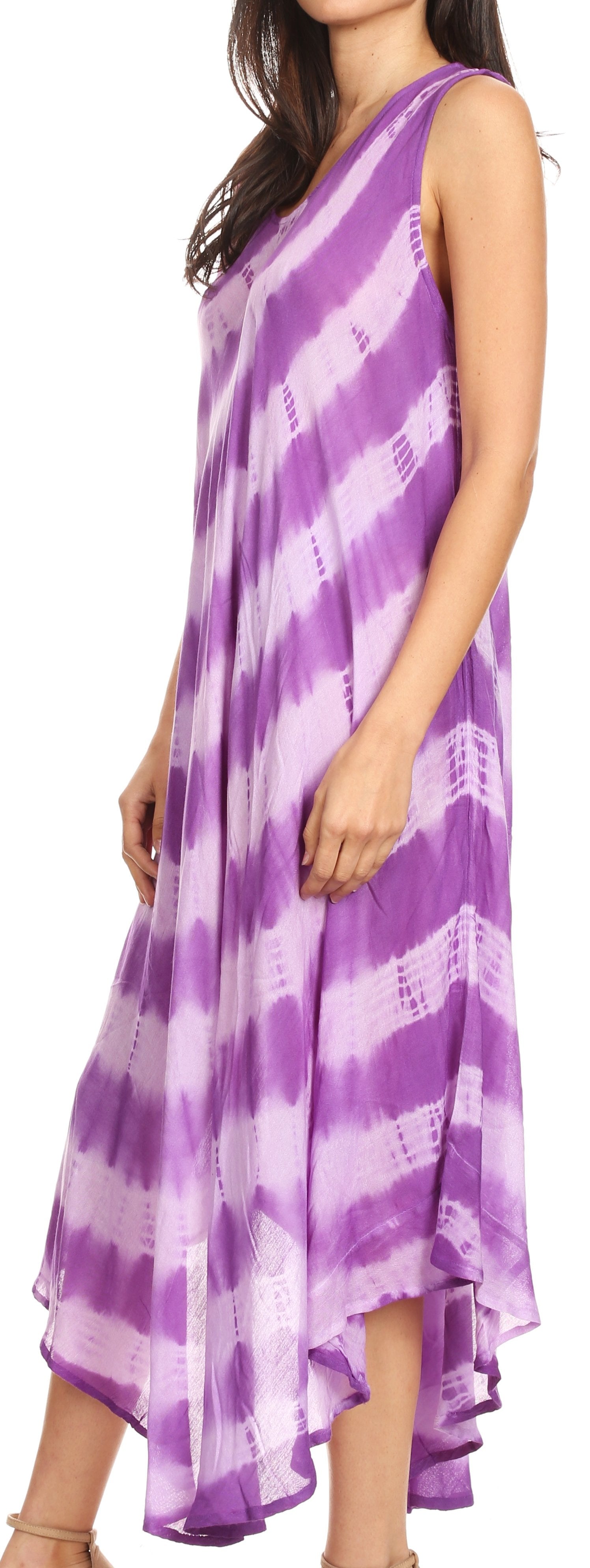 Woman wearing a purple and white tie-dye dress on a white background
