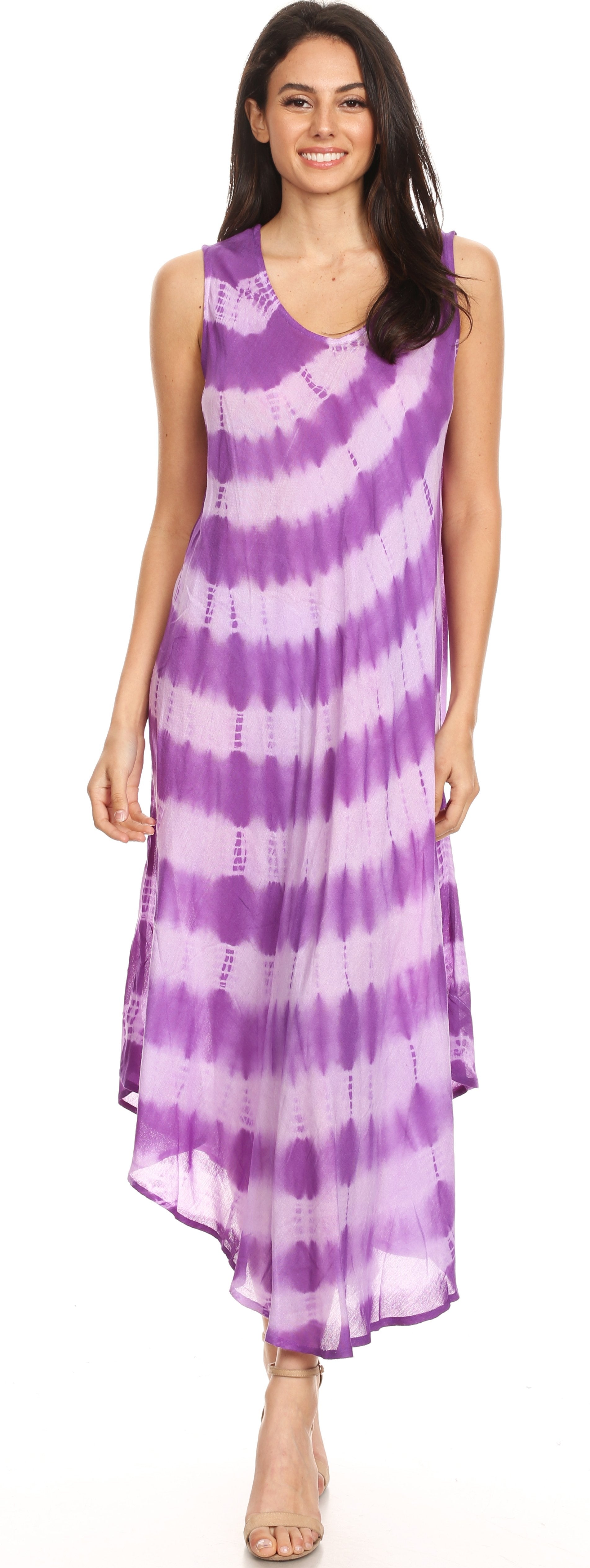 Woman wearing a purple and white tie-dye dress on a white background