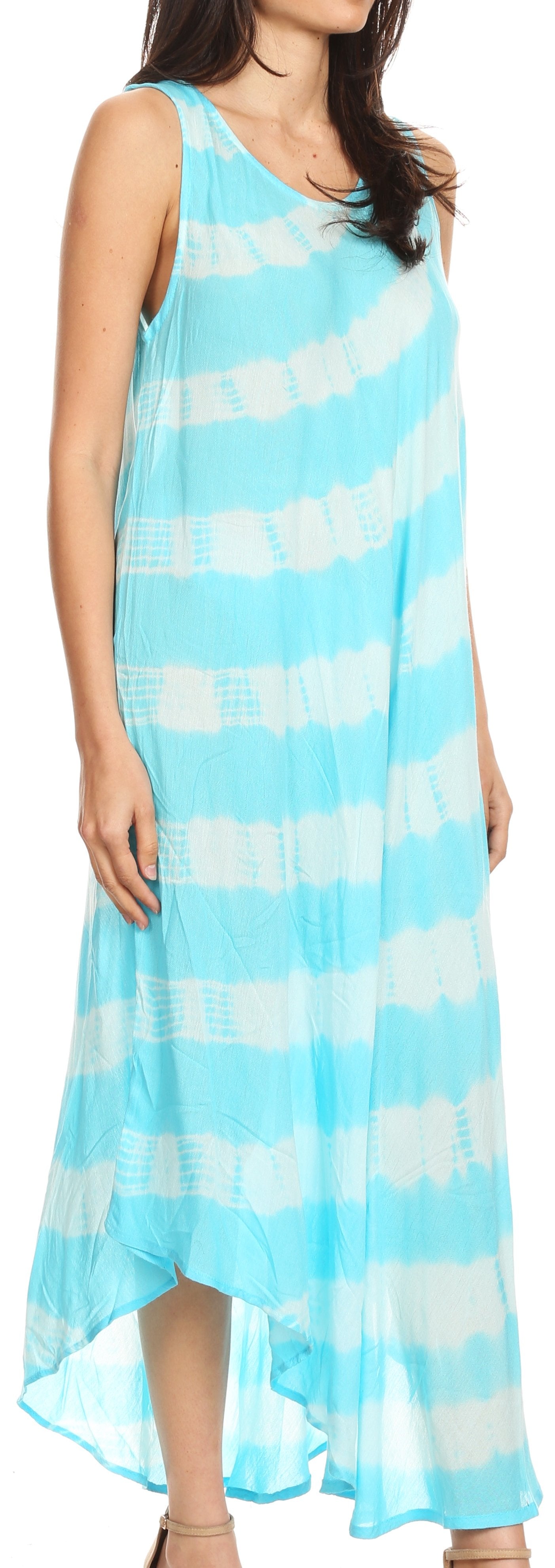 Woman wearing a blue and white striped dress with a high-low hem.