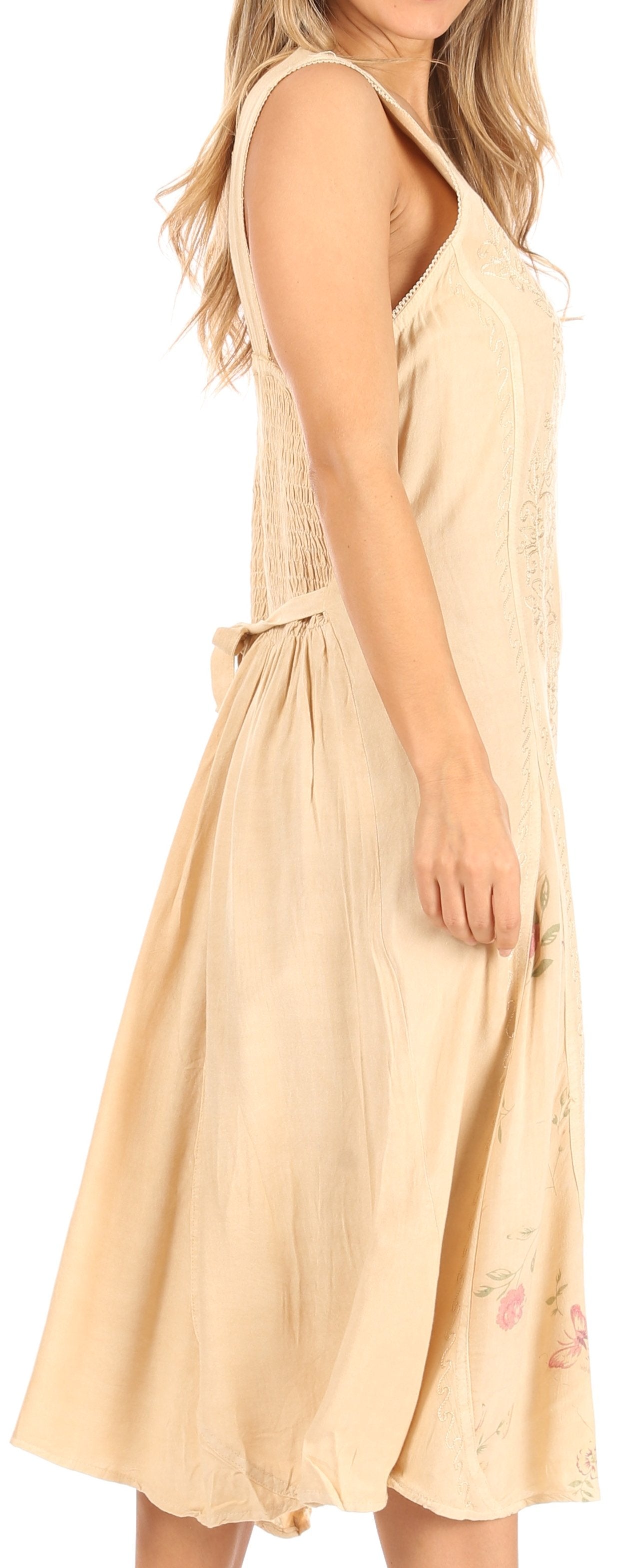 Beige sleeveless dress worn by a person on a white background