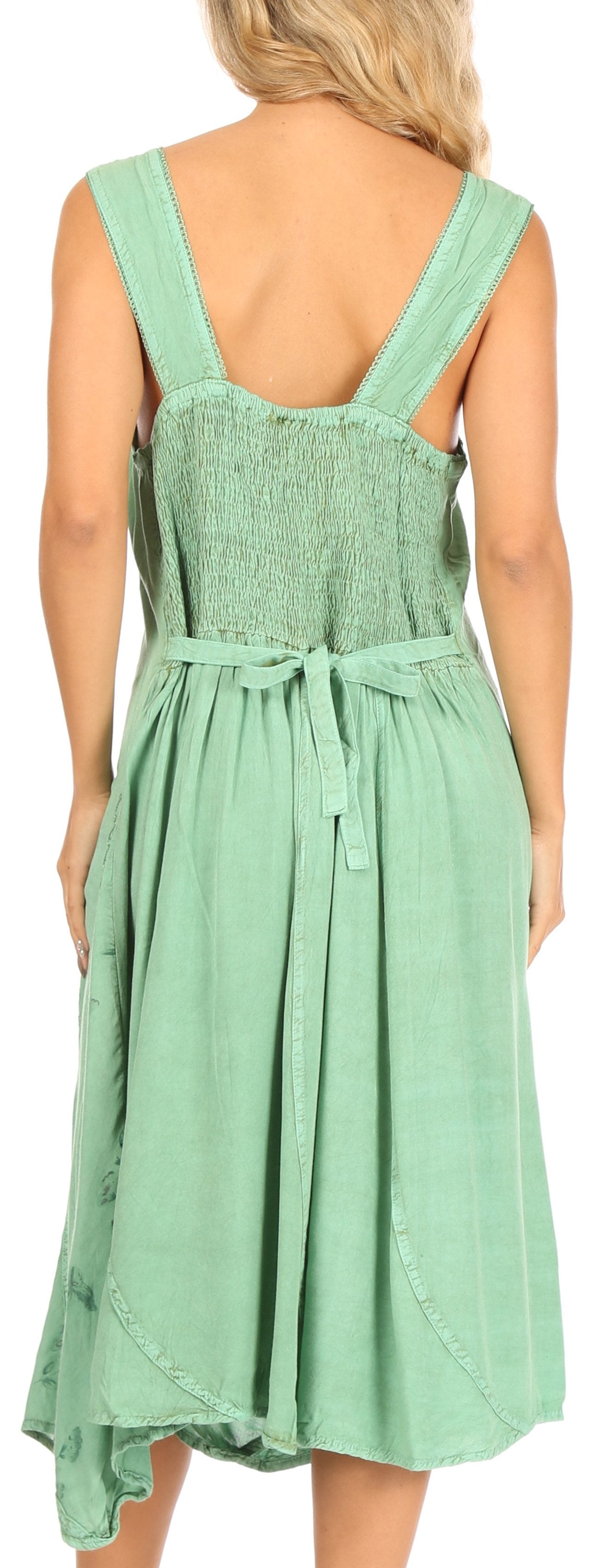 Green dress with criss-cross straps on a person, back view