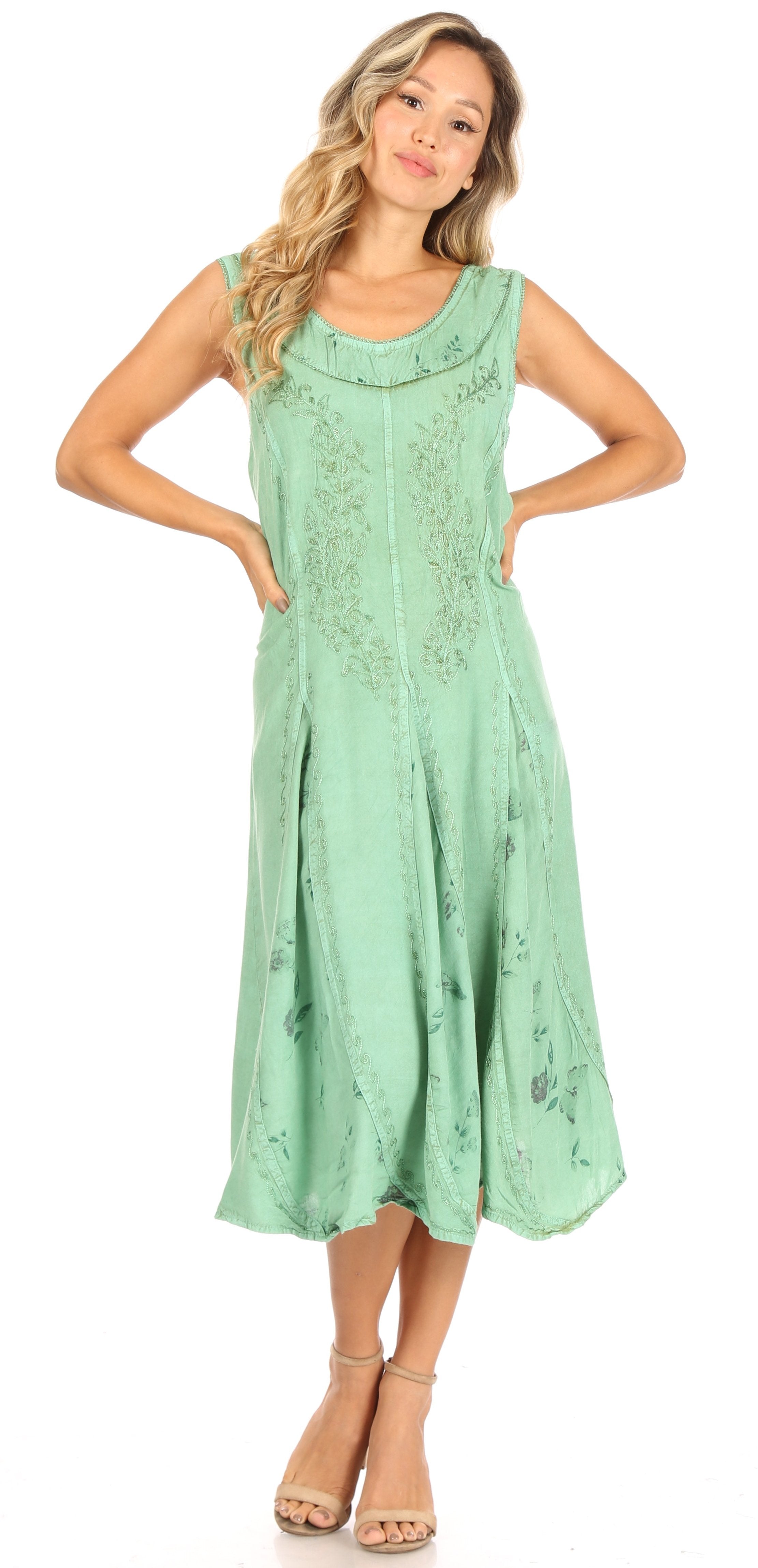 Woman wearing a green dress on a white background