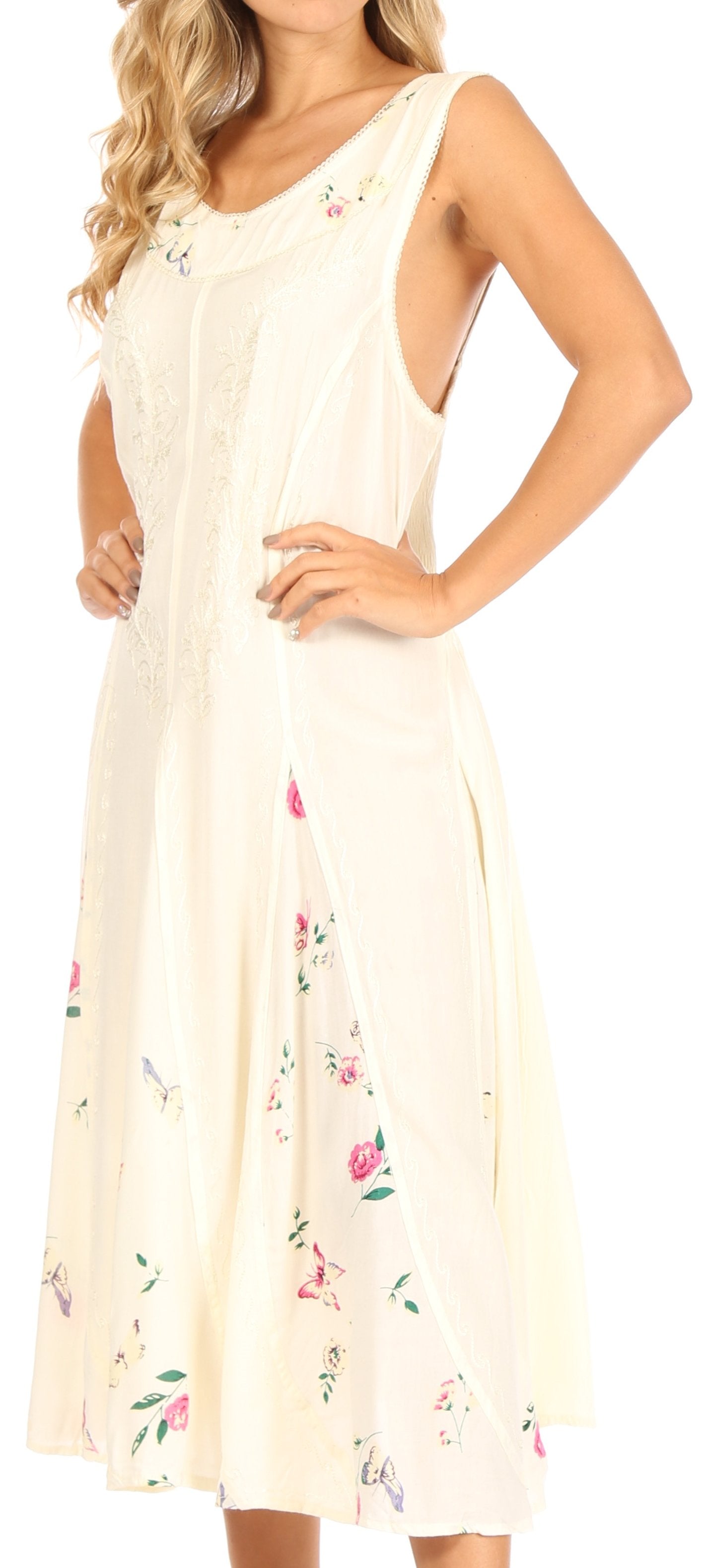Woman wearing a cream-colored dress with floral patterns