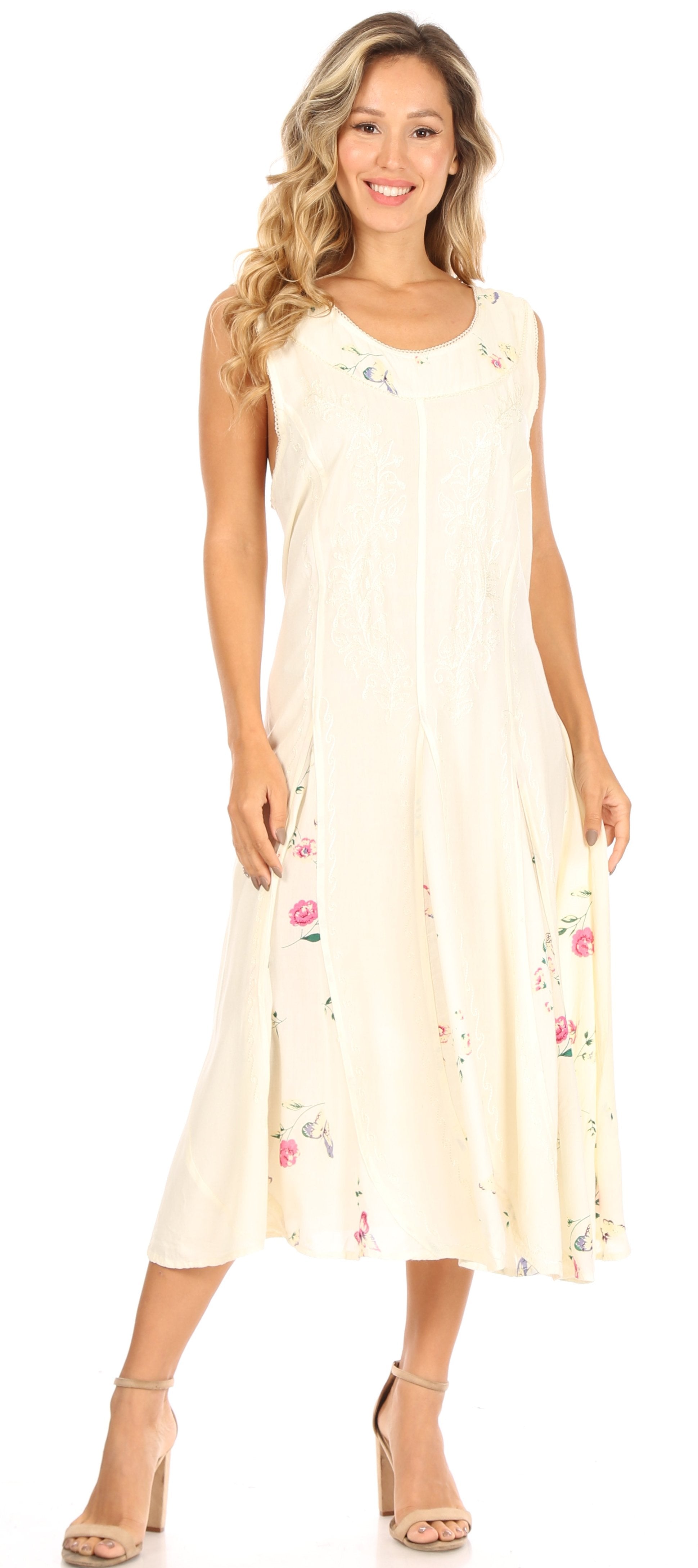 Woman wearing a cream-colored dress with floral patterns on a white background