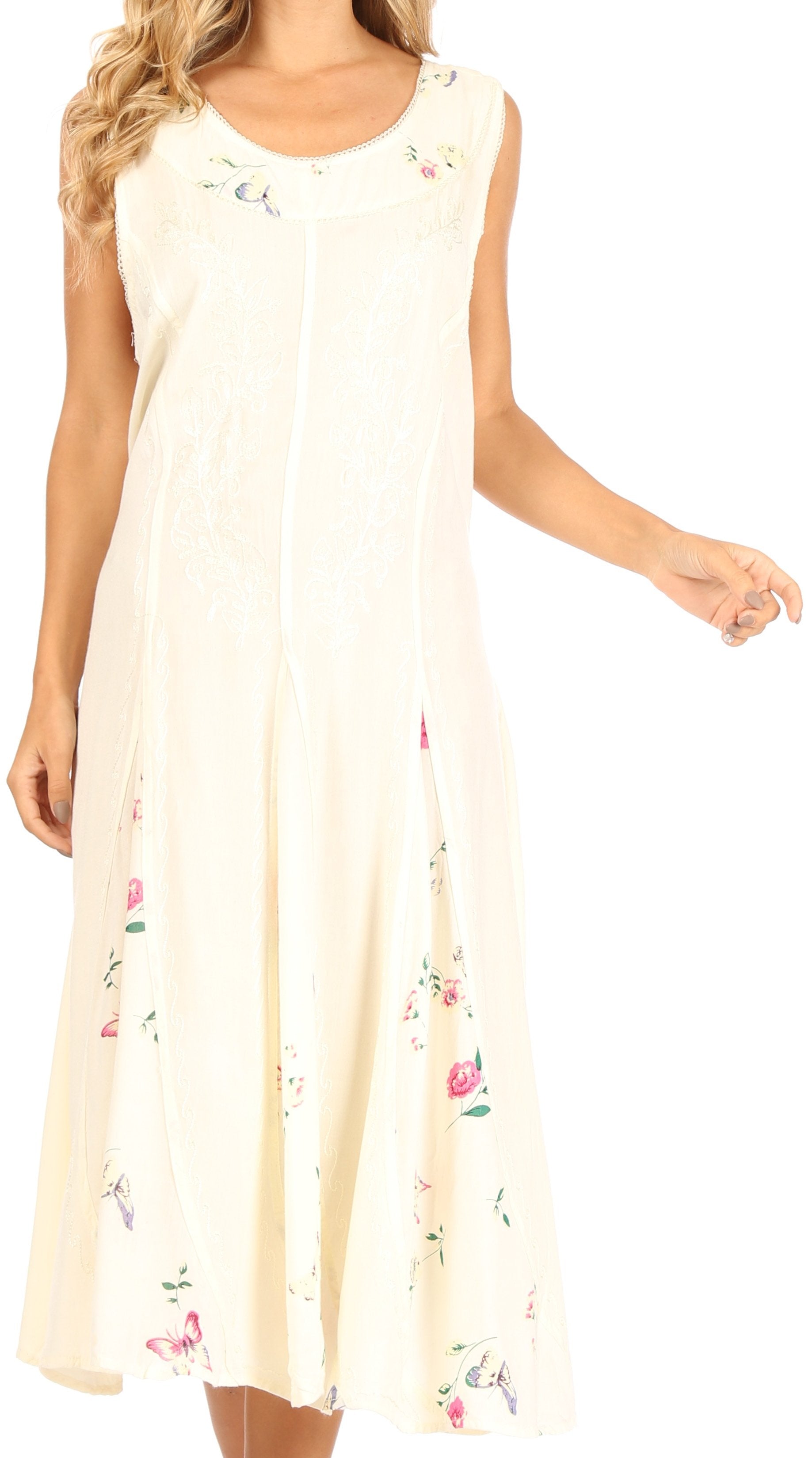 Woman wearing a cream-colored dress with floral embroidery on a white background