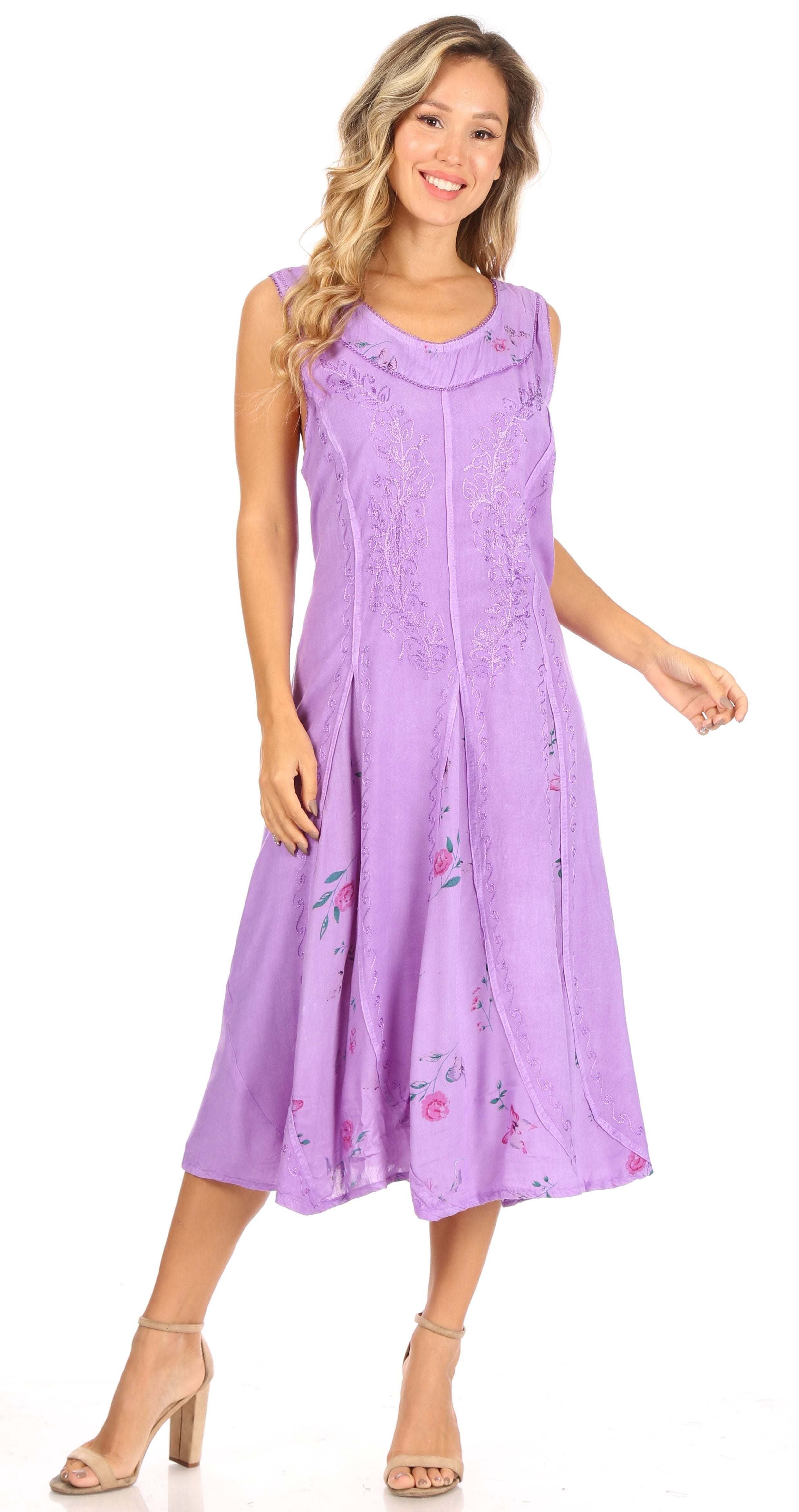 Woman wearing a purple dress with floral patterns on a white background