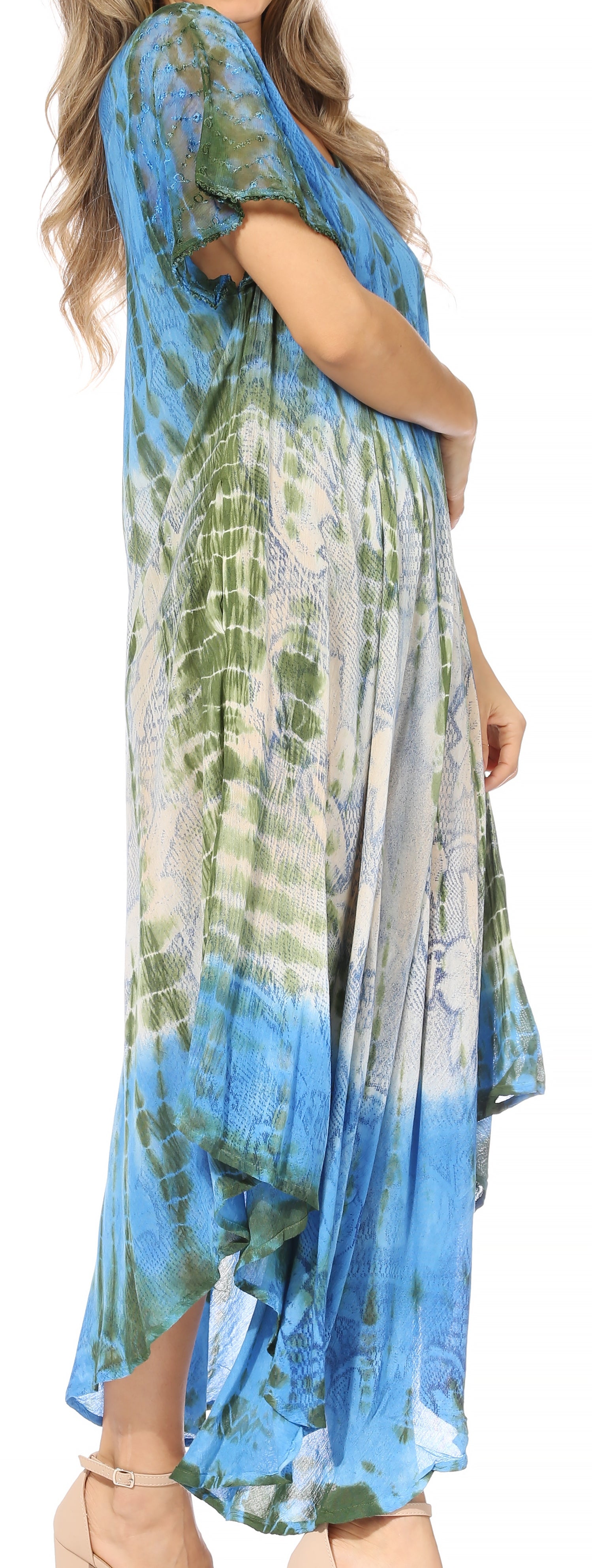 Woman wearing a blue and green tie-dye dress.